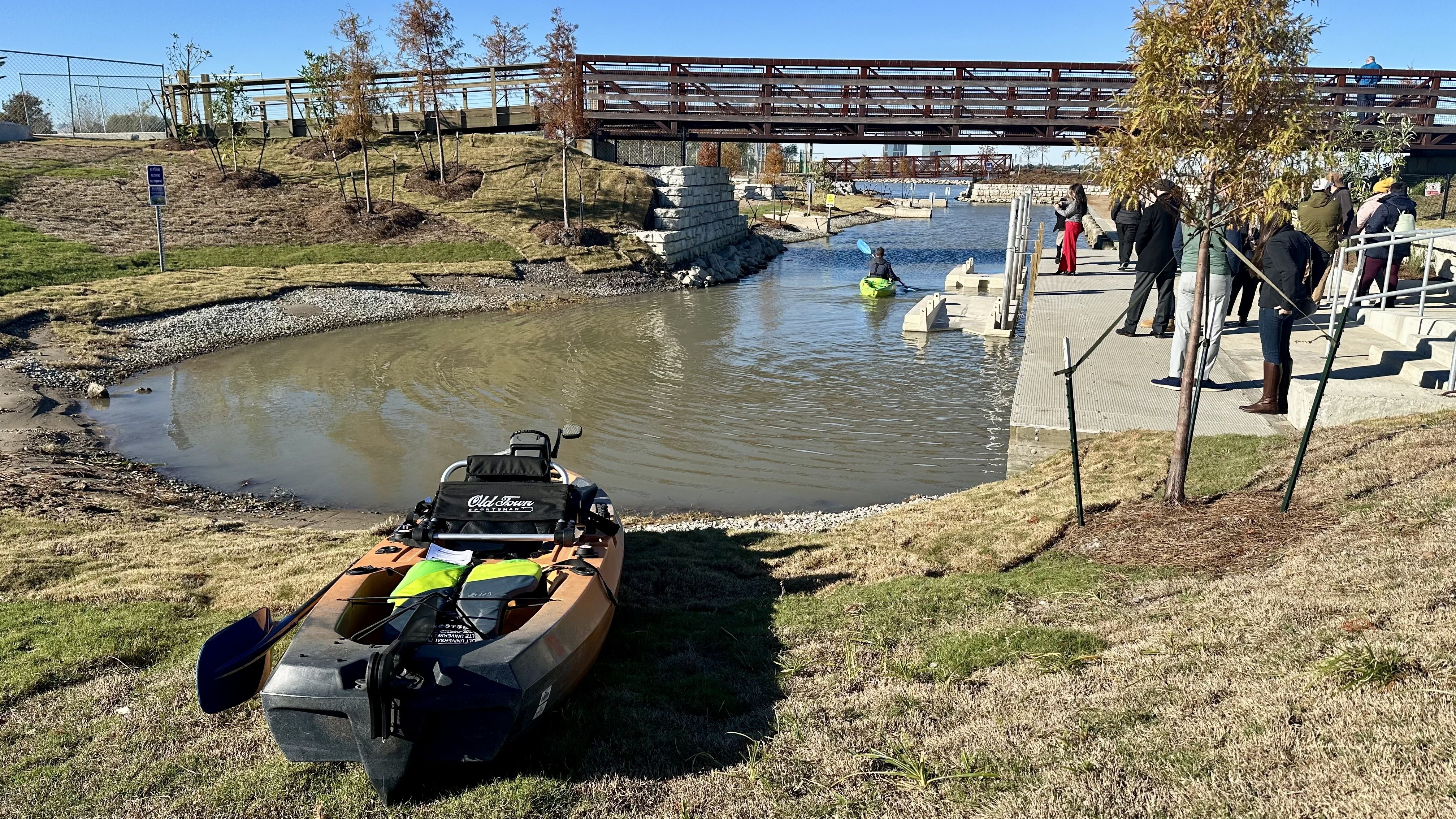 Image shows a kayak on the grass.