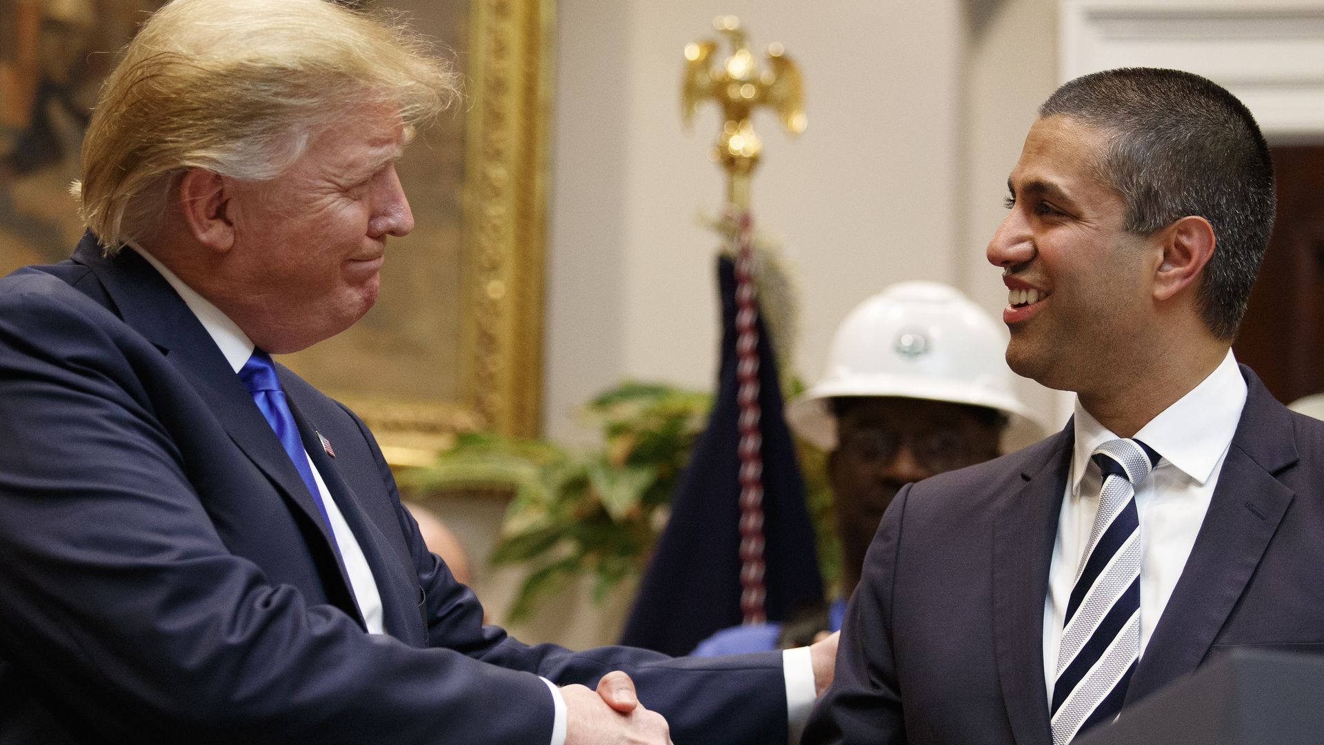 Photo of President Trump shaking hands with FCC chairman Ajit Pai