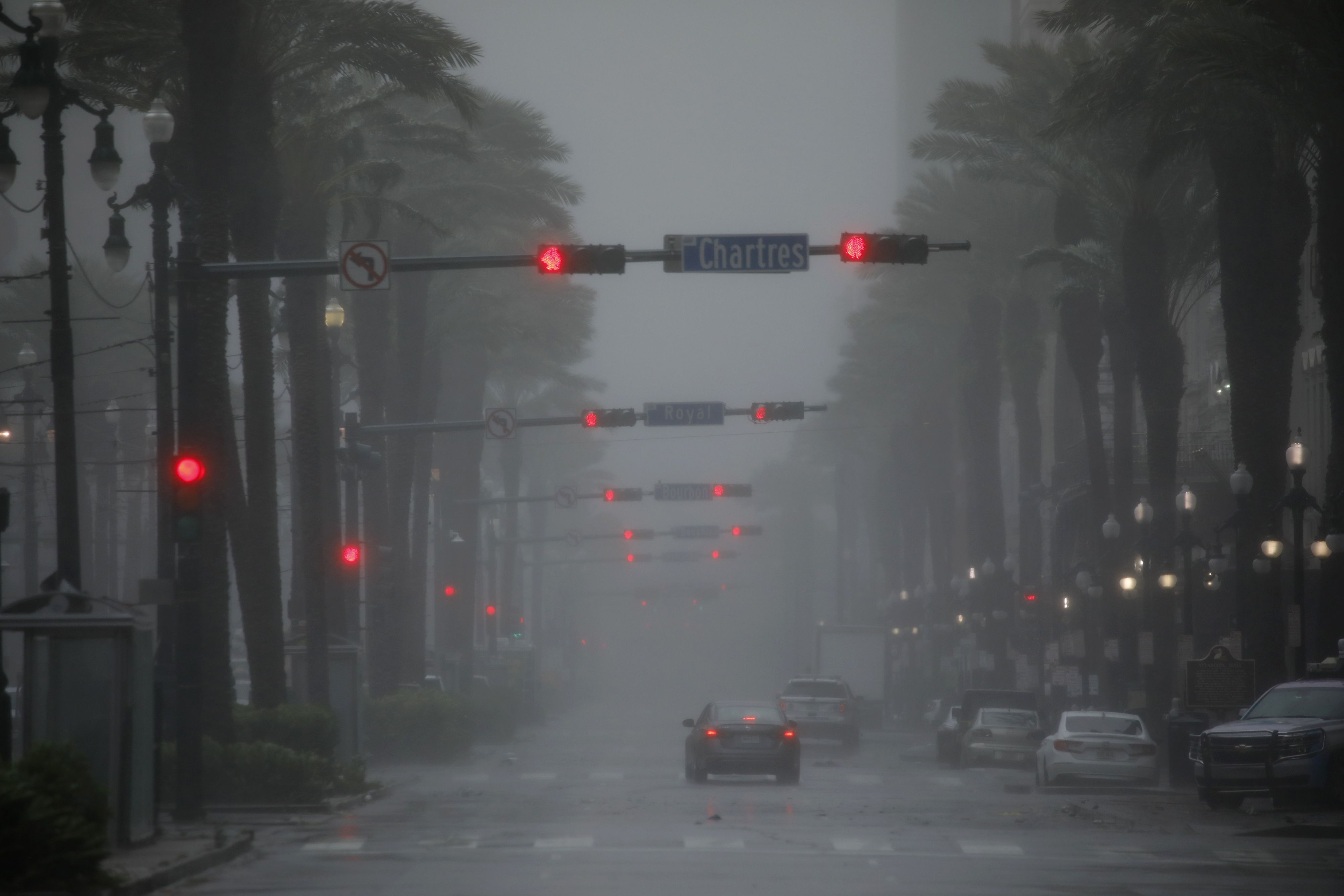 Motorists drive down Canal Street as Hurricane Ida makes landfall in New Orleans, Louisiana,