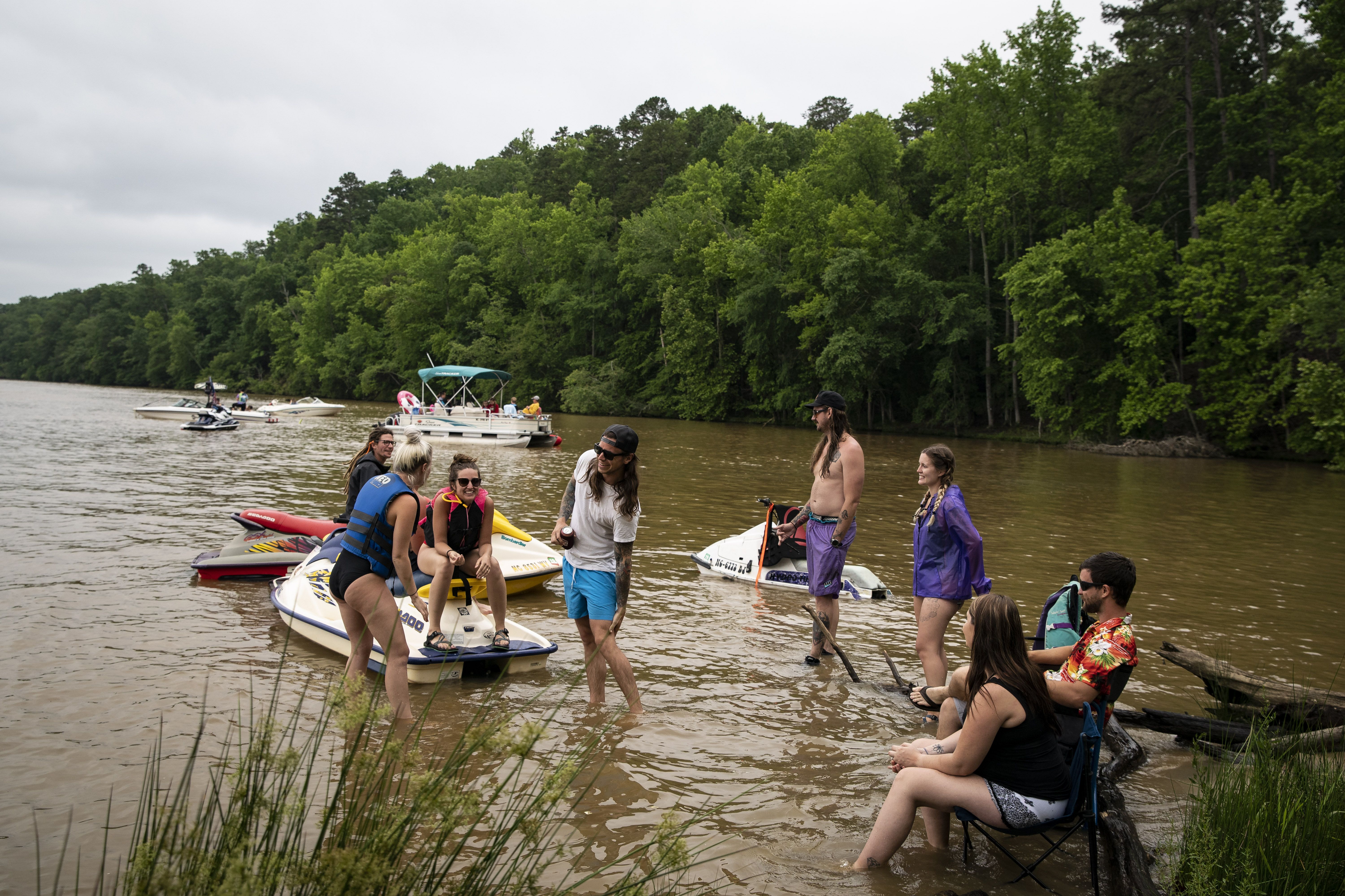 People hang out on a sandbar on Lake Tillery on May 25, 2020 in Mount Gilead, North Carolina. 