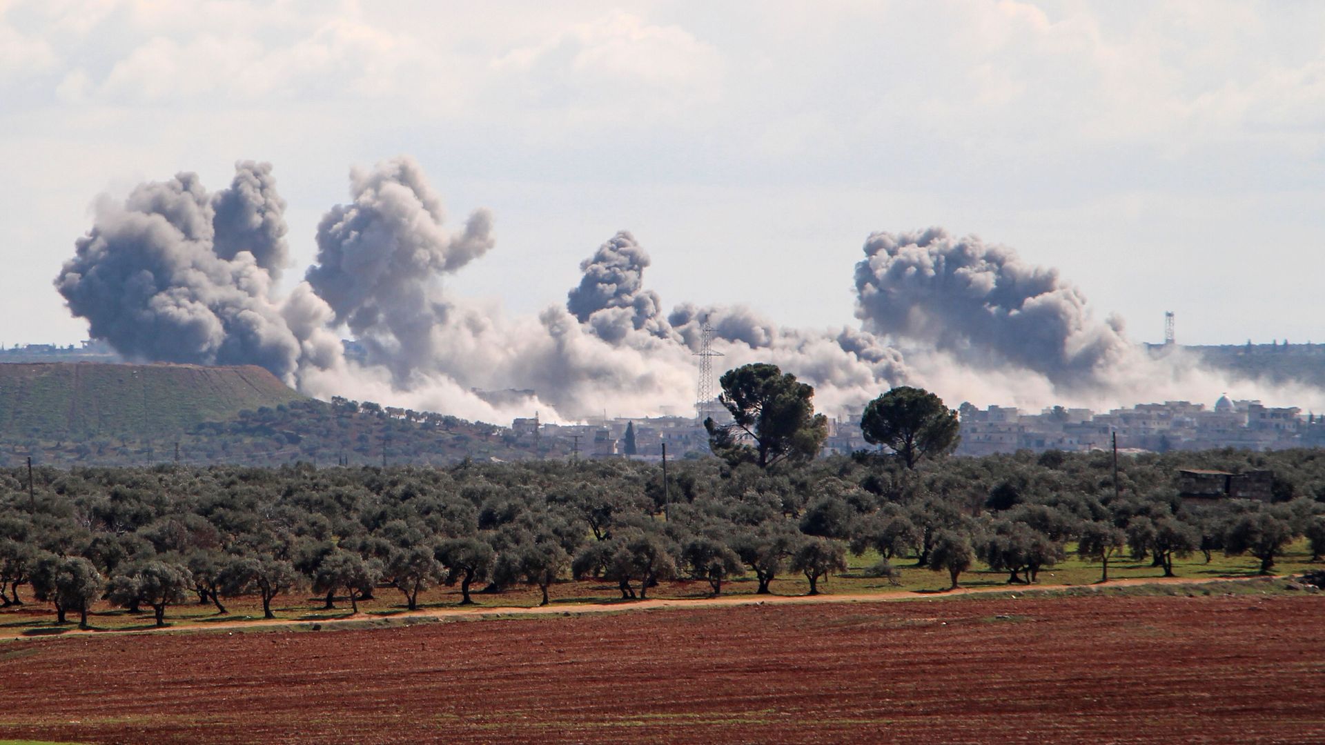 Smoke billowing over the village of Qaminas on March 1 following a Russian airstrike