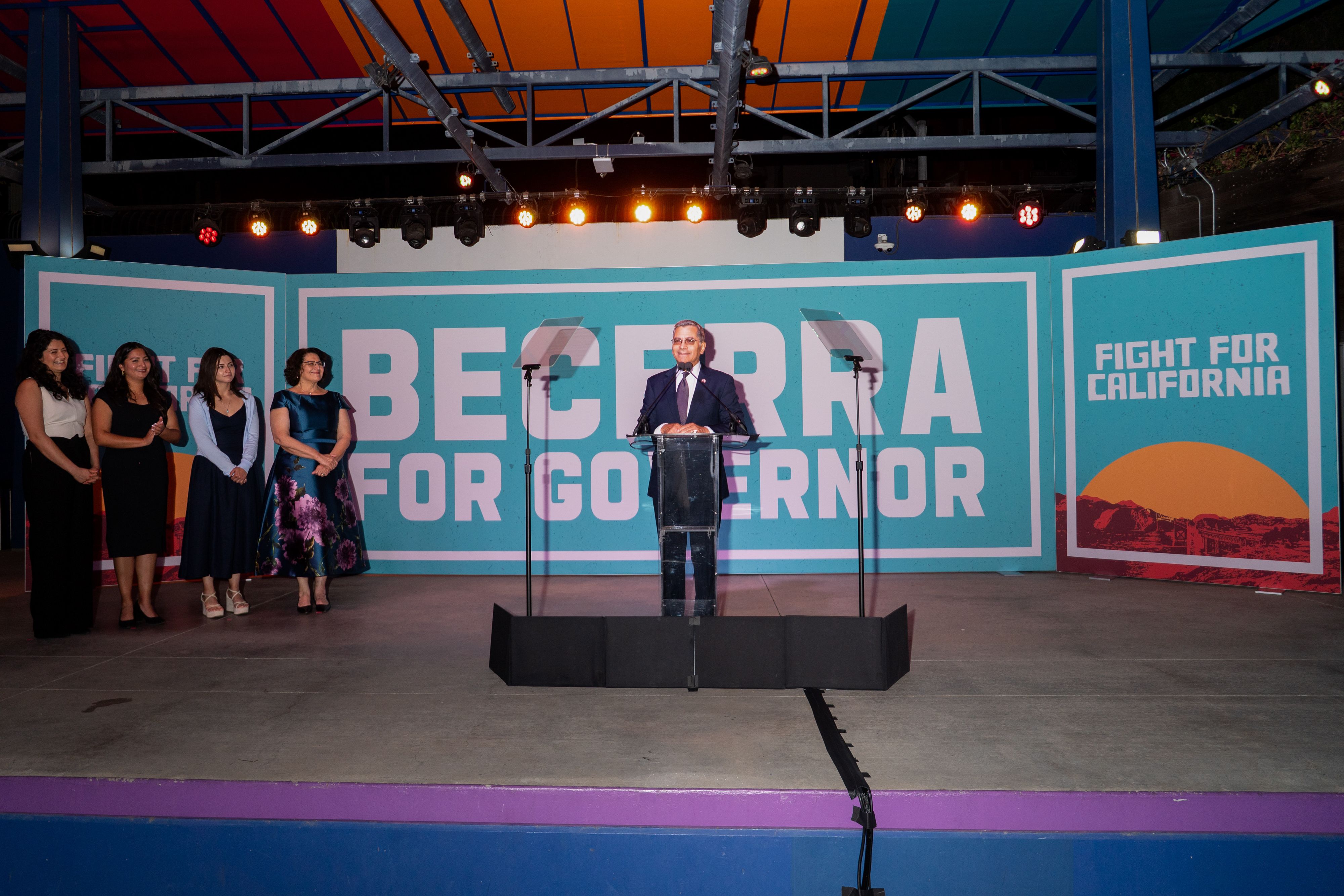 Xavier Becerra, Democratic gubernatorial candidate for California, joined by his wife Carolina Reyes and their daughters, speaks during a primary election night event in Los Angeles, California, US, on Tuesday, June 2, 2026. The vote tabulation generally takes days to complete in California election