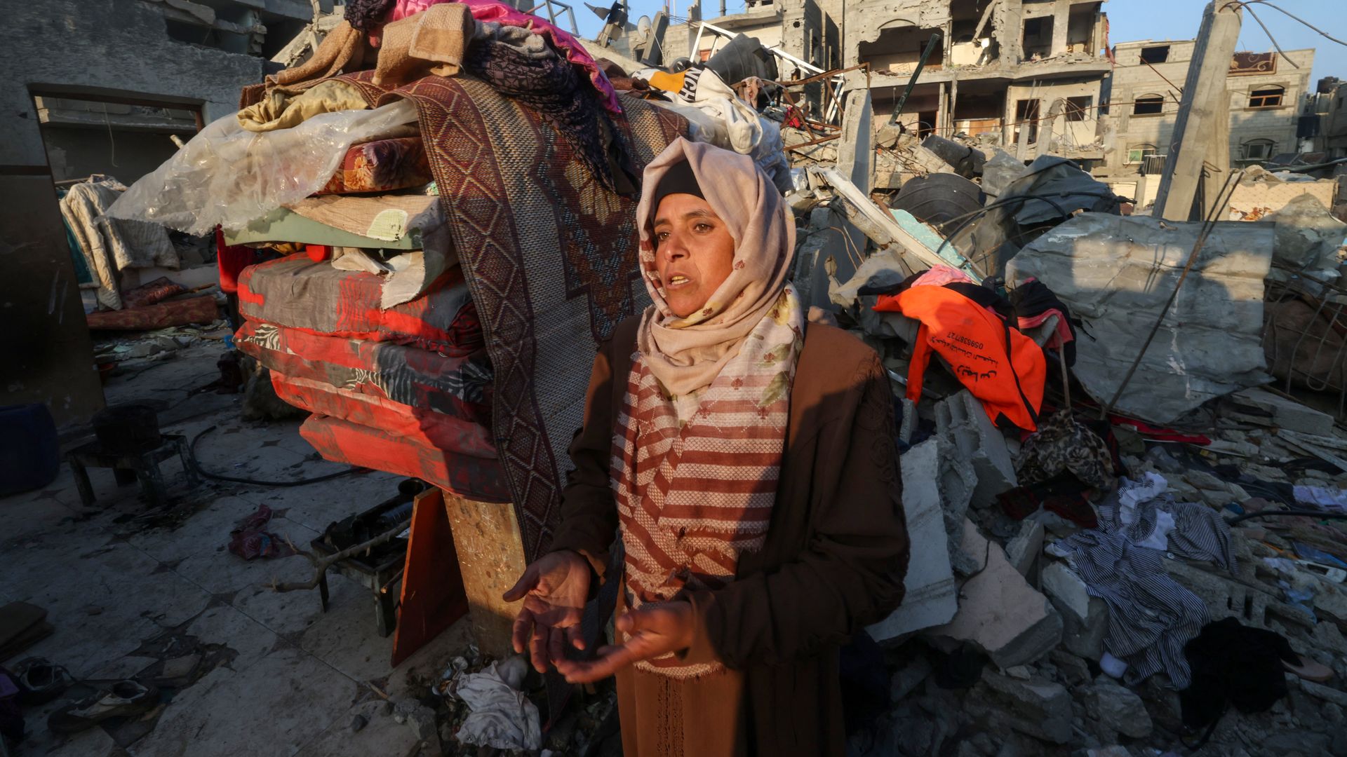  A woman reacts standing in front of a house destroyed in Israeli bombardment in Rafah refugee camp on Jan. 1. Photo: AFP via Getty Images