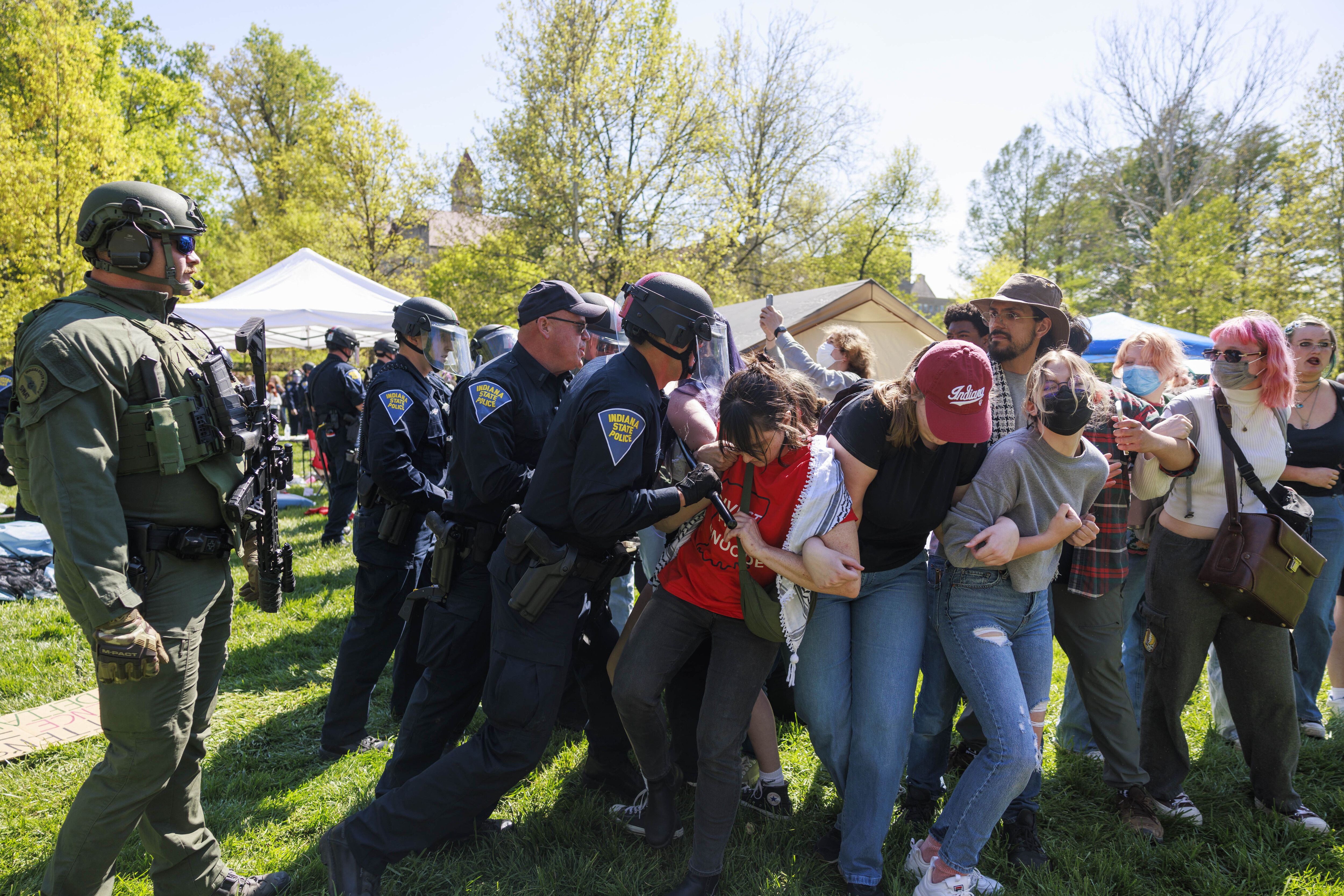A police officer arresting protestors