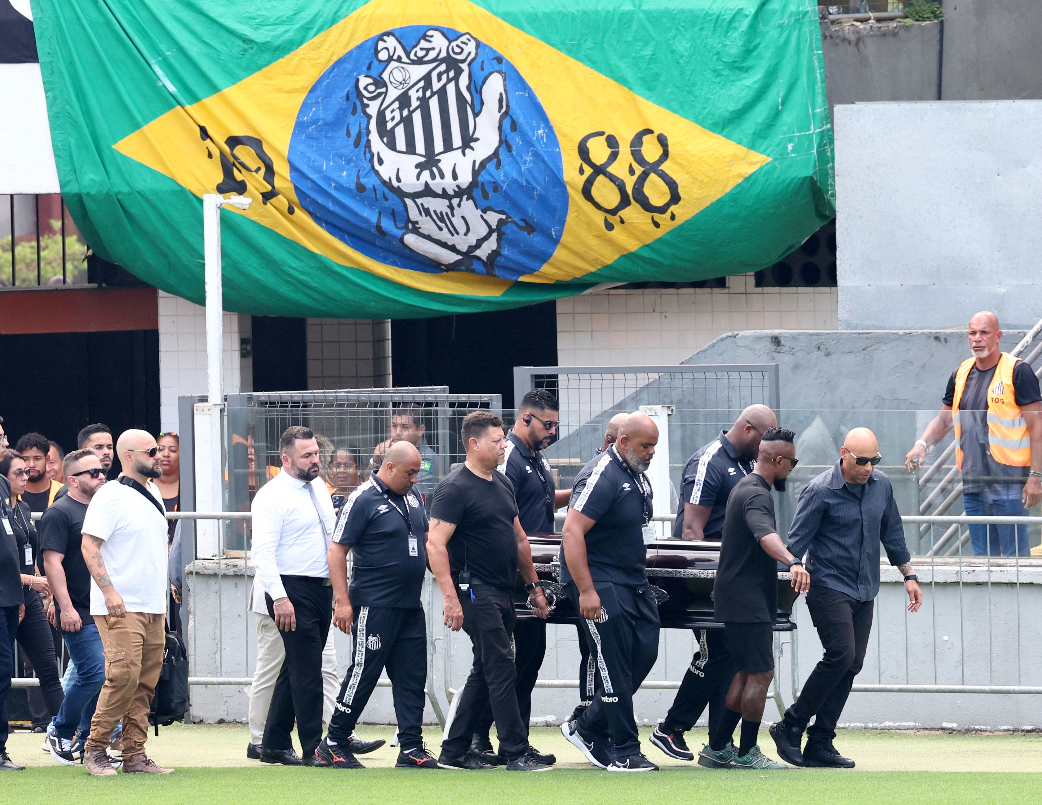 Edinho, son of Pelé and former football player Ze Roberto carry Pele's coffin into Urbano Caldeira Stadium for his funeral on January 02, 2023 in Santos, Brazil. 