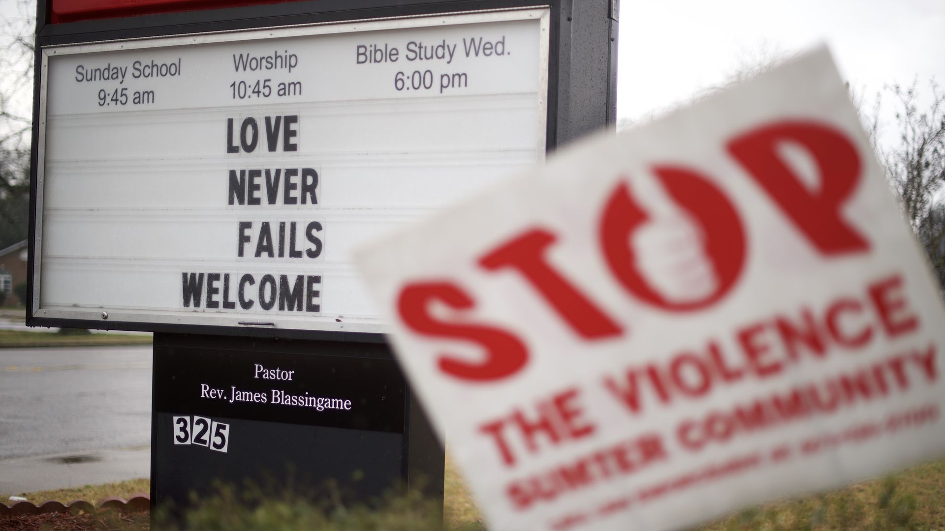 A sign outside a Baptist church says, "Love never fails. Welcome." 