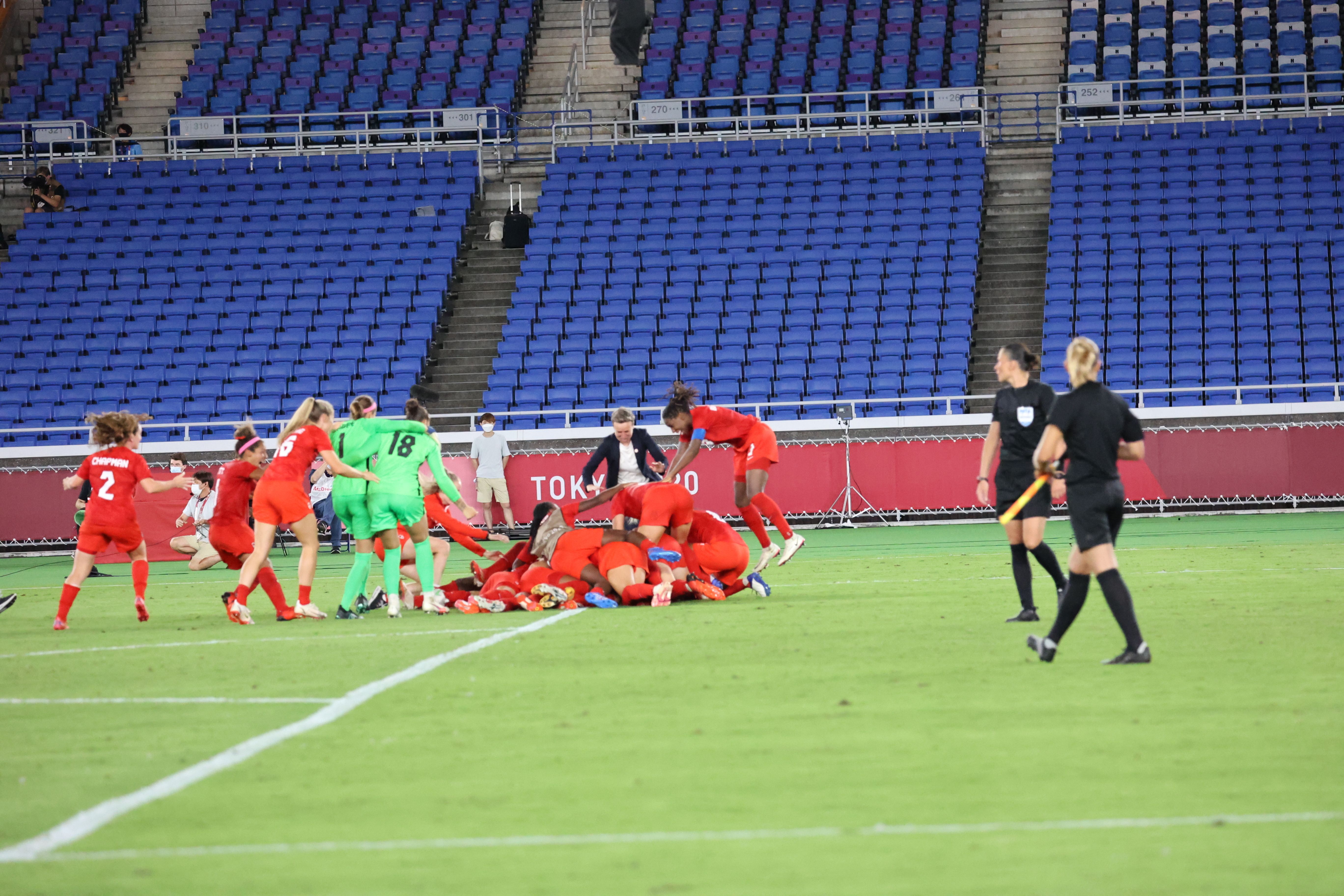 Canada celebrates after winning the gold medal game.