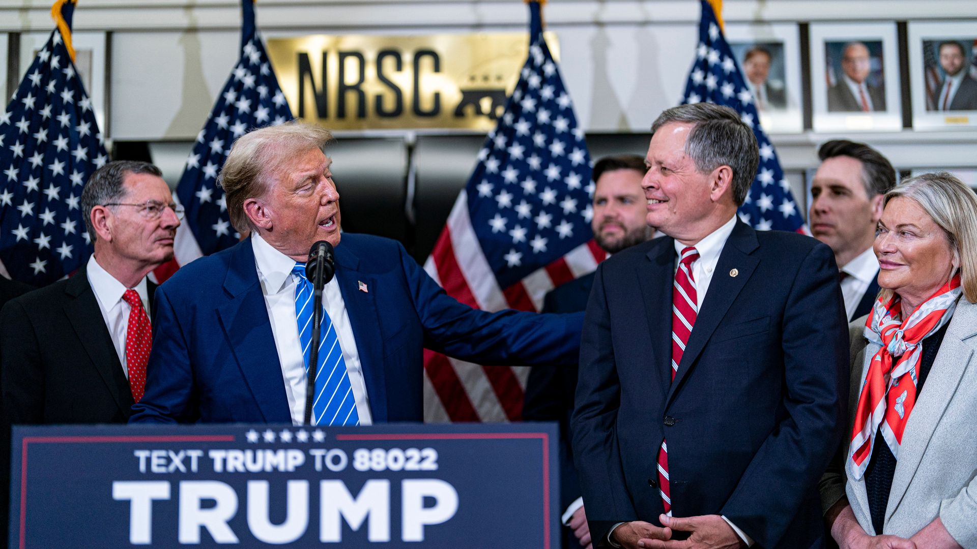 Former US President Donald Trump greets Senator Steve Daines following a meeting with Senate Republicans 