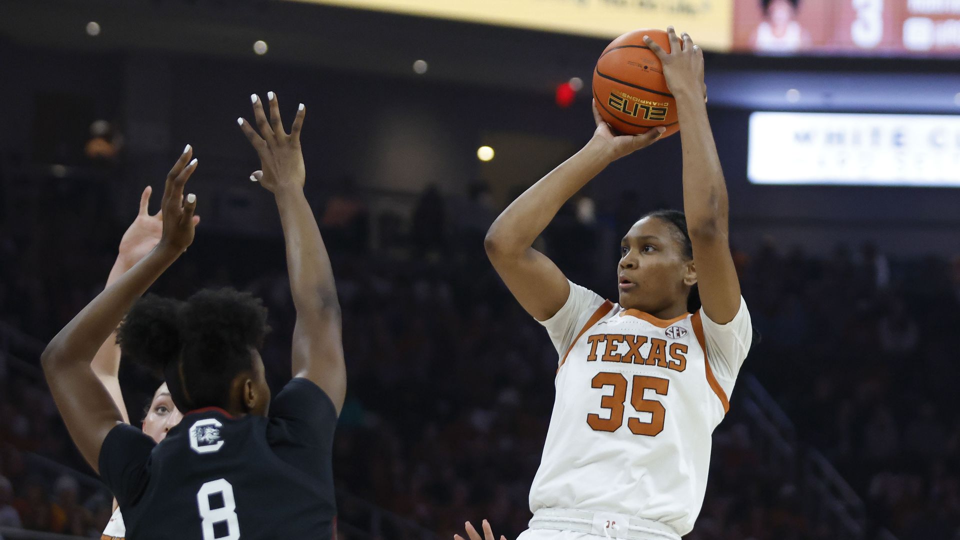 Texas basketball player Madison Booker taking a shot.