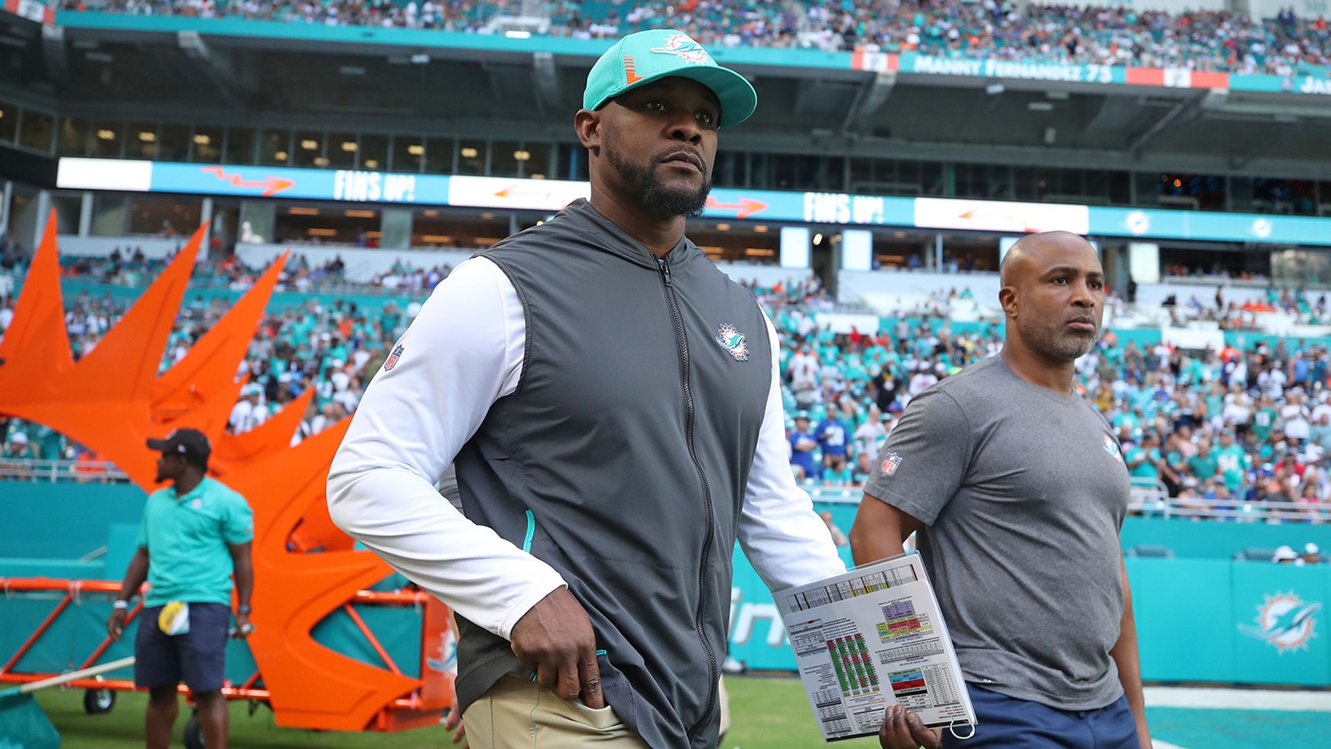 Former Miami Dolphins coach Brian Flores taking the field in December 2021.