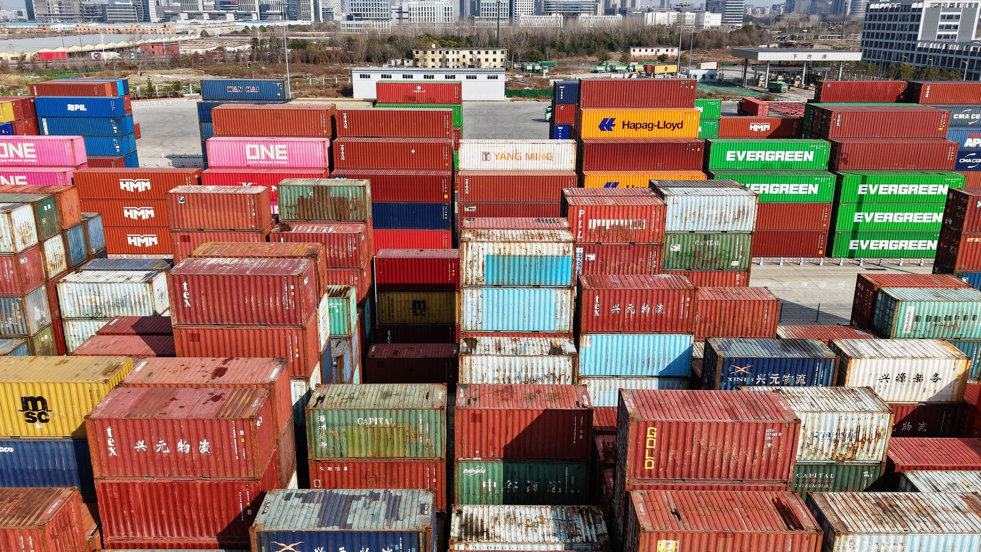 Foreign trade containers are stacked at the Xiasha Port freight yard in Hangzhou, China, on March 2