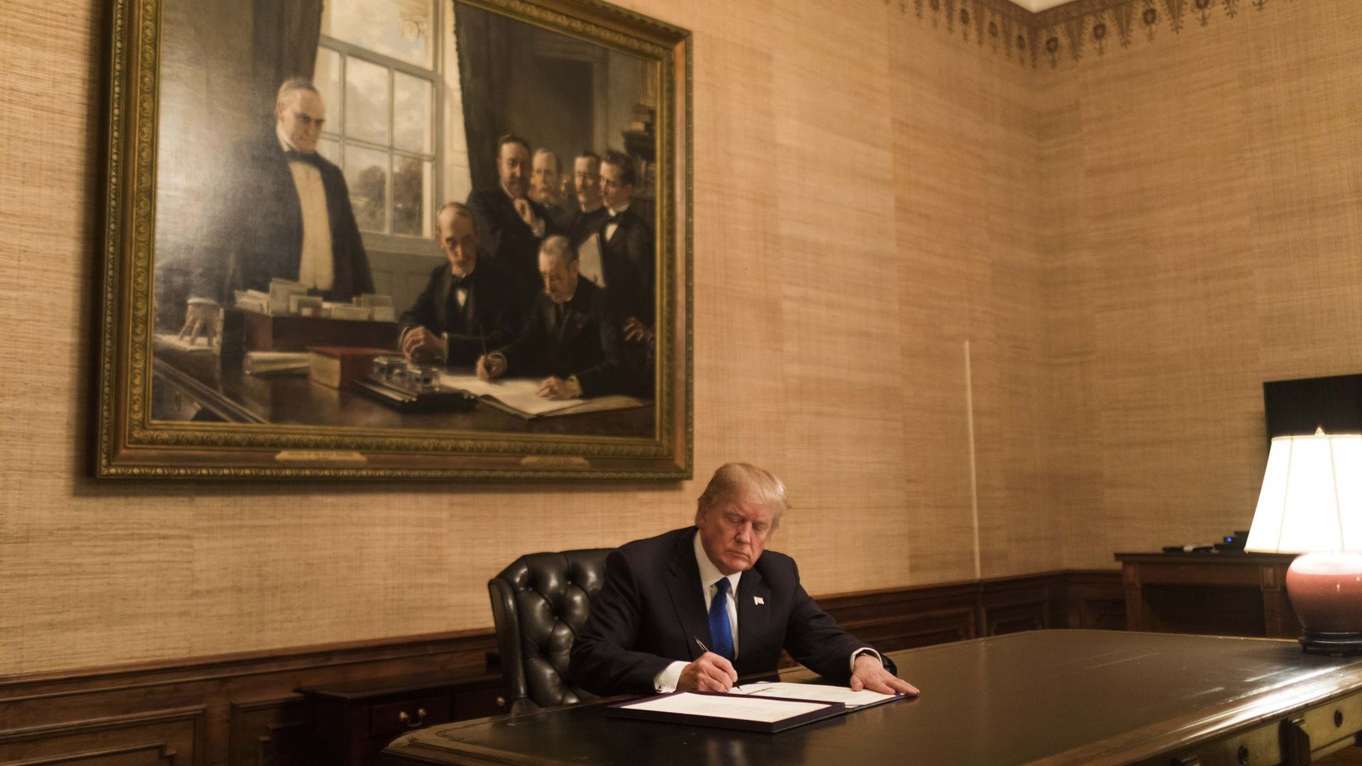Donald Trump signing a bill