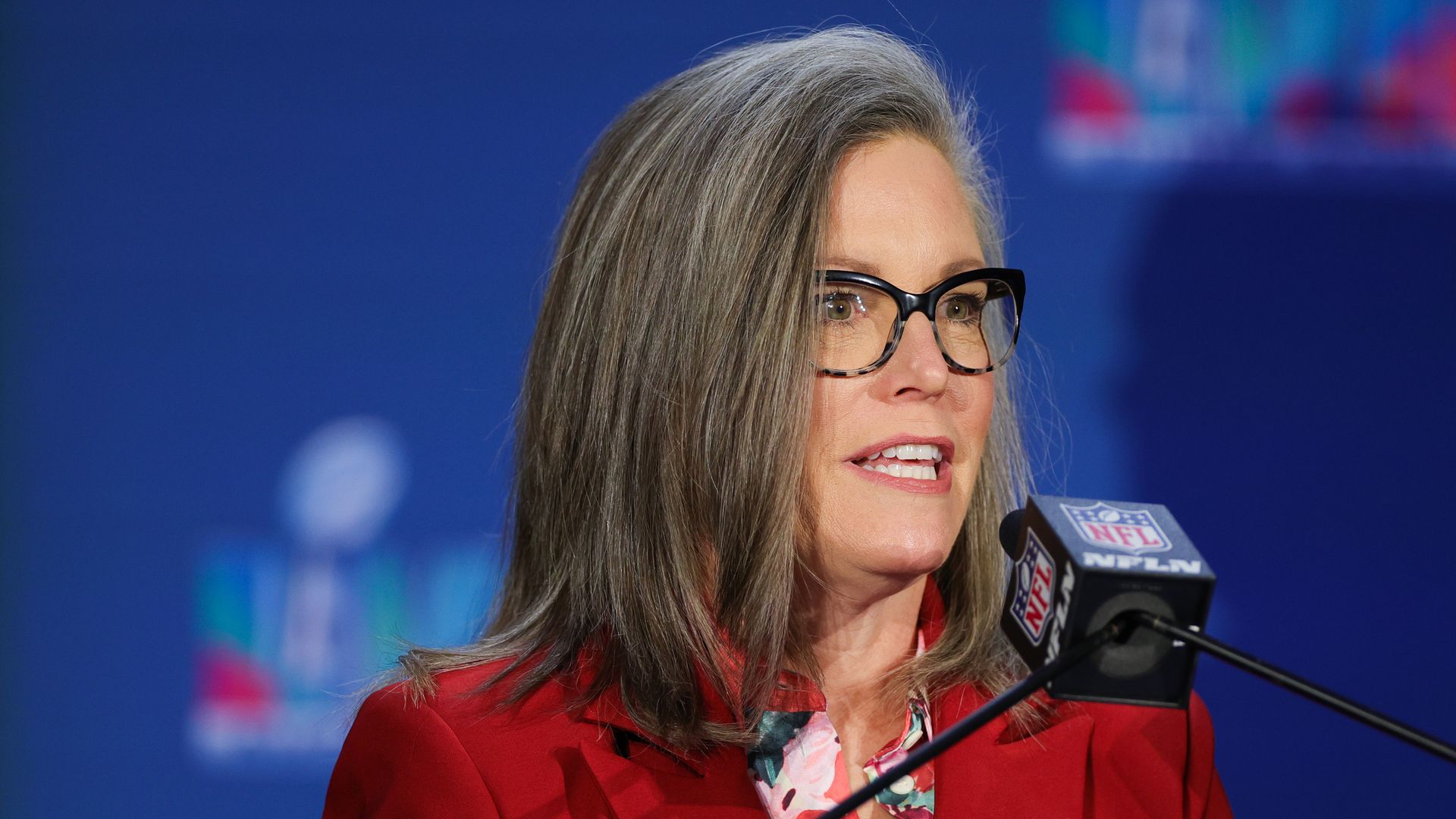 A woman at a podium.