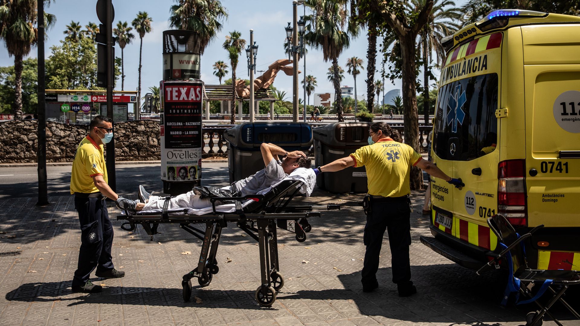 Paramedics tending to a patient in Barcelona, Spain, during a heat wave in July 2022.
