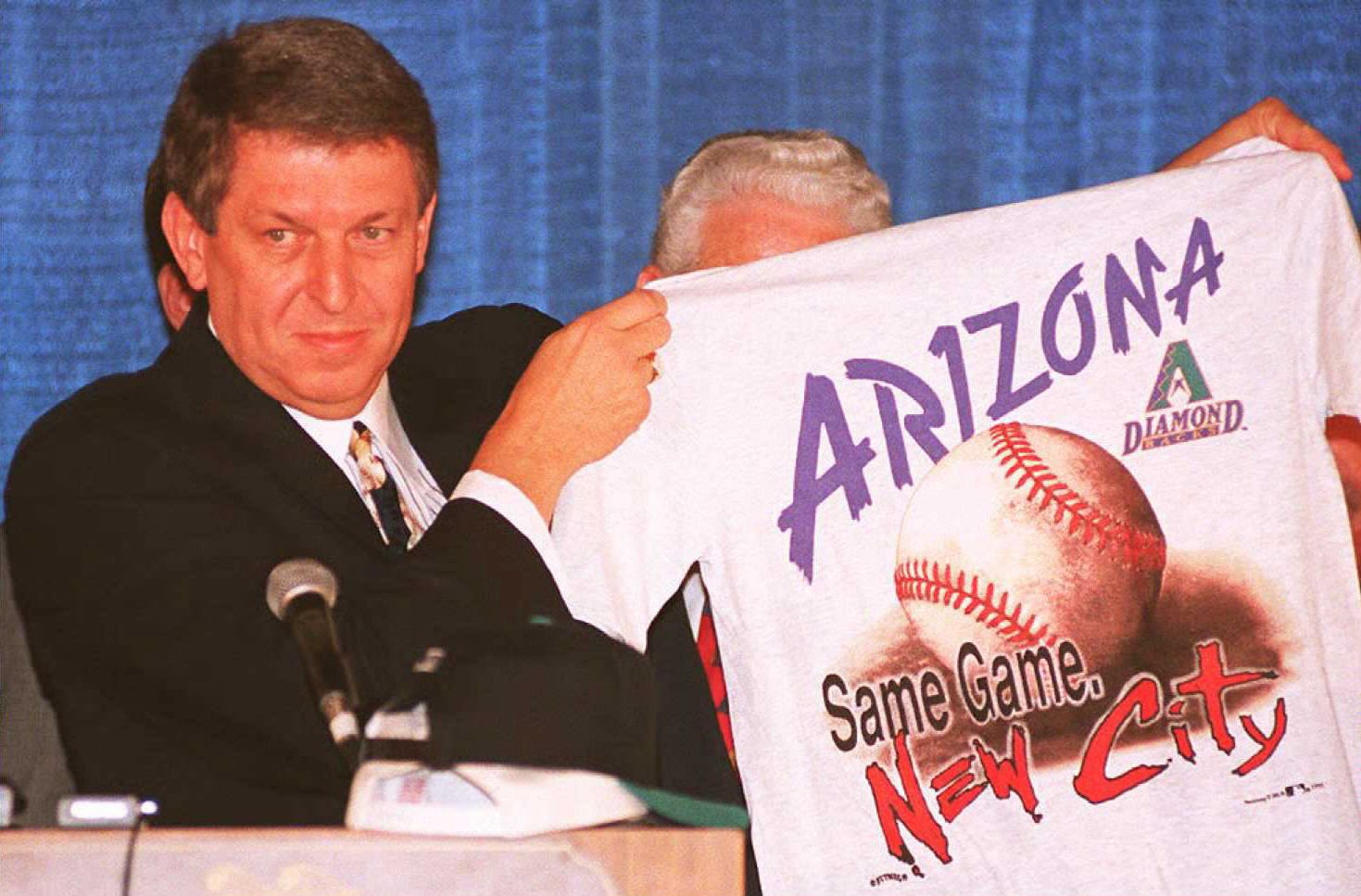 Owner holding an Arizona Diamondbacks shirt
