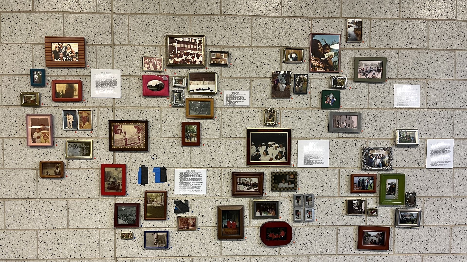 Photo of a wall full of framed photos 