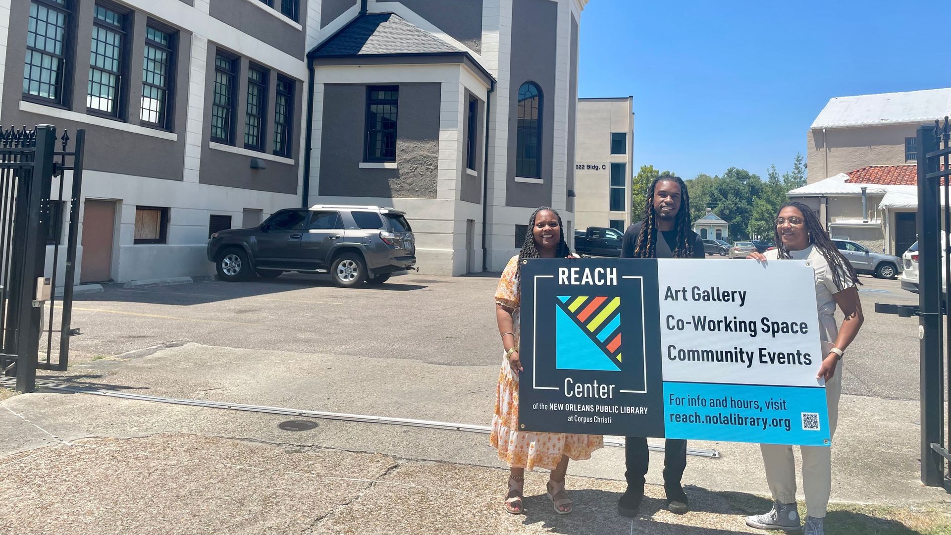 Photo shows librarians standing in front of the 7th Ward community center