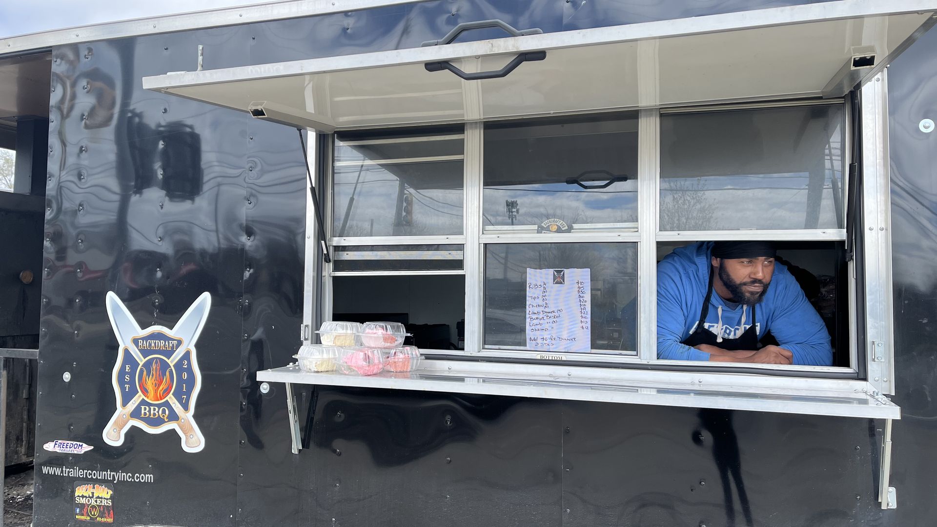 Backdraft BBQ 17 owner Curtis Eason inside his food truck.