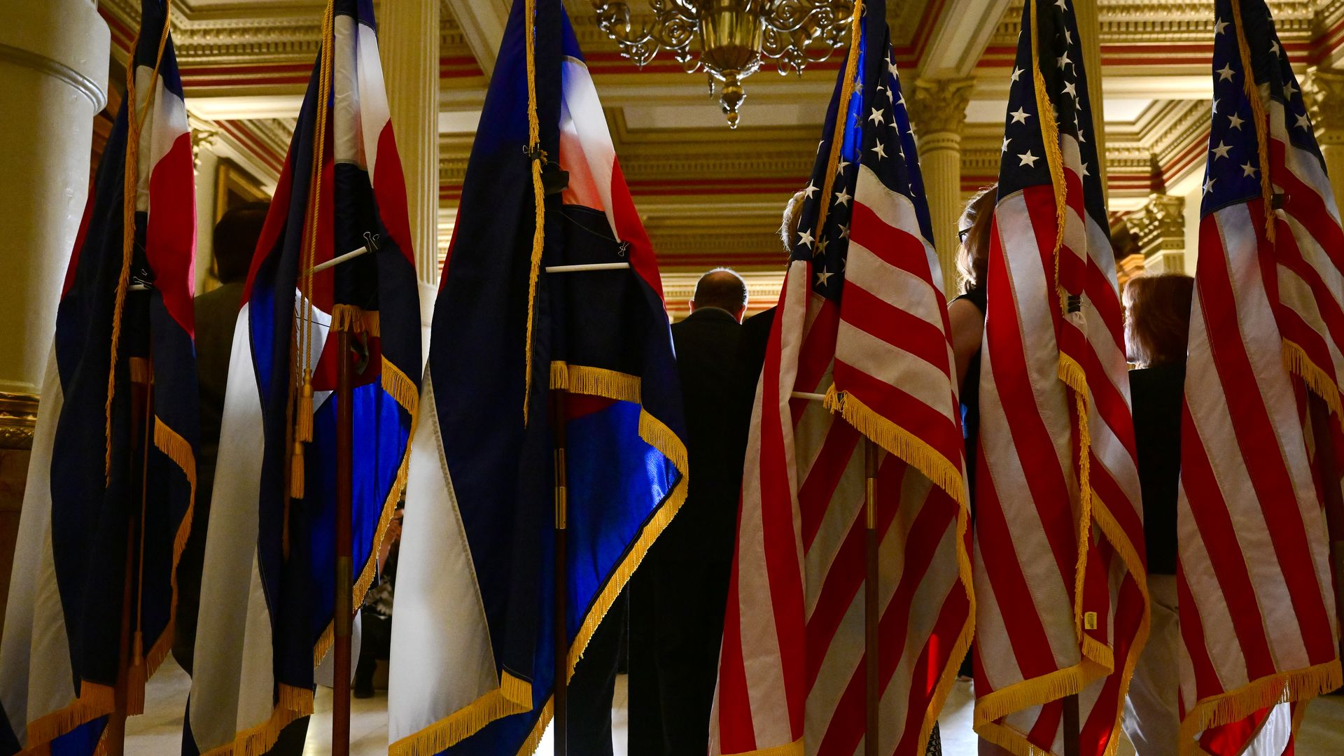 Gov. Jared Polis, center, speaks to the media Tuesday about the legislative session. Photo: Helen H. Richardson/Denver Post via Getty Images