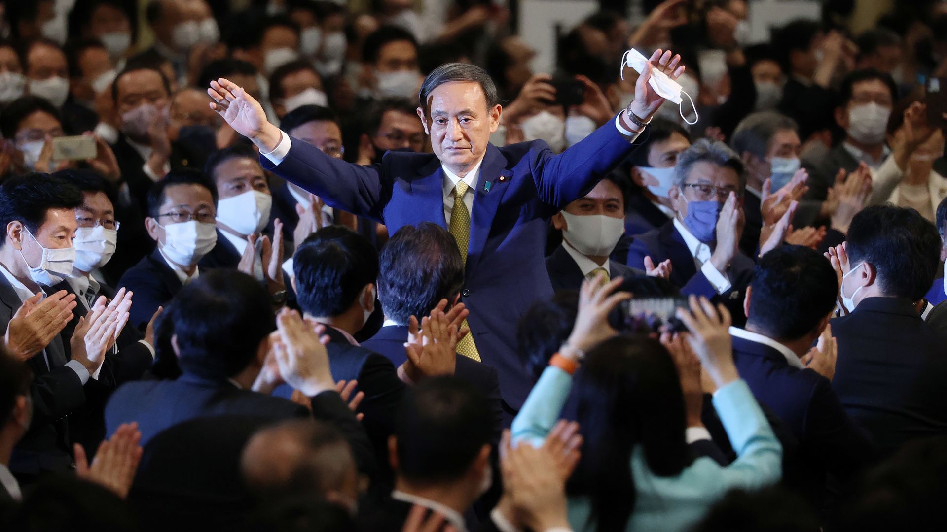 Japan Prime Minister Yoshide Suga is seen celebrating his election as head of his political party.