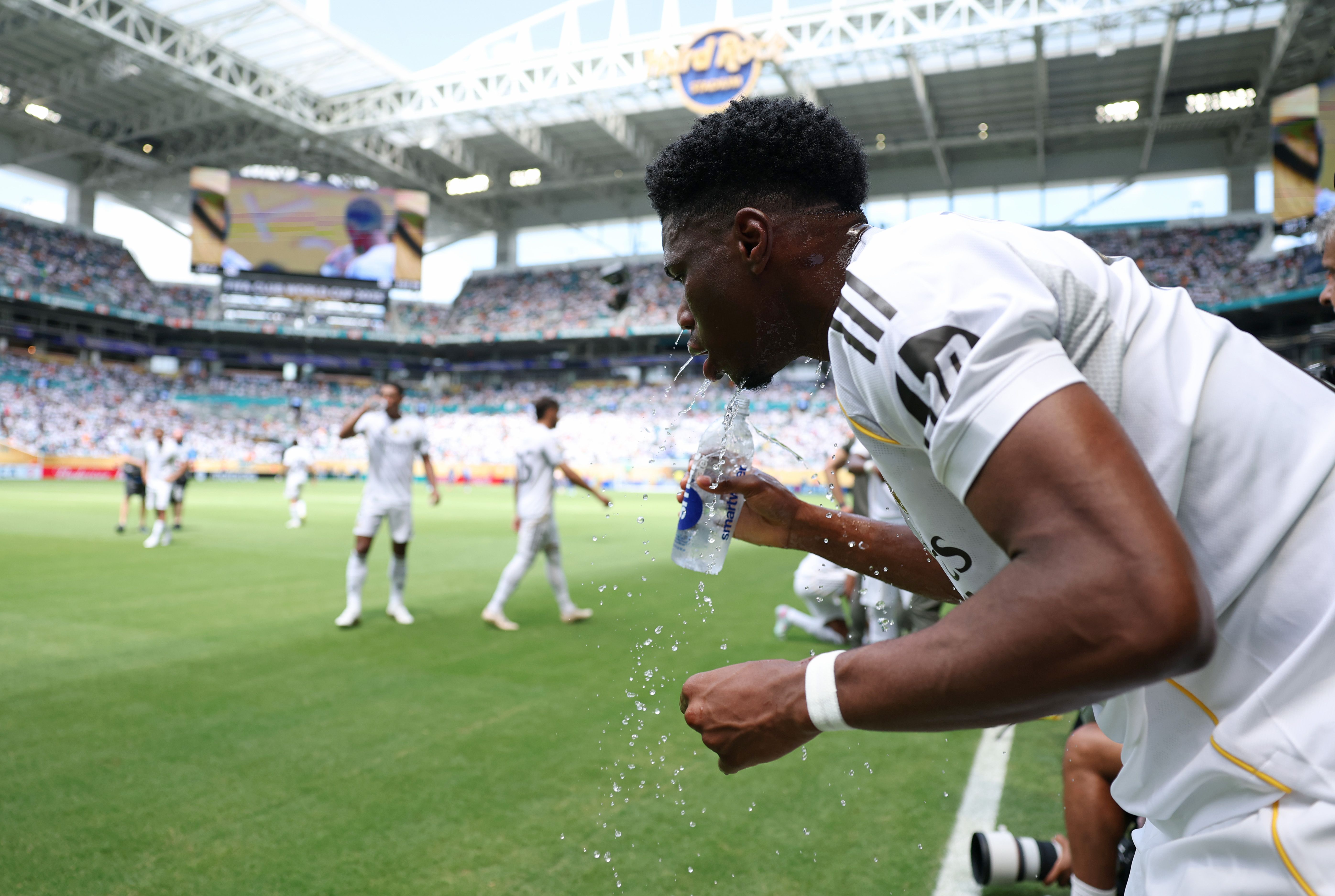 MIAMI GARDENS, FLORIDA - JUNE 18: Aurelien Tchouameni #14 of Real Madrid C. F. cools off during a water break during the FIFA Club World Cup 2025 group H match between Real Madrid CF and Al Hilal at Hard Rock Stadium on June 18, 2025 in Miami Gardens, Florida. (Photo by Dan Mullan/Getty Images)