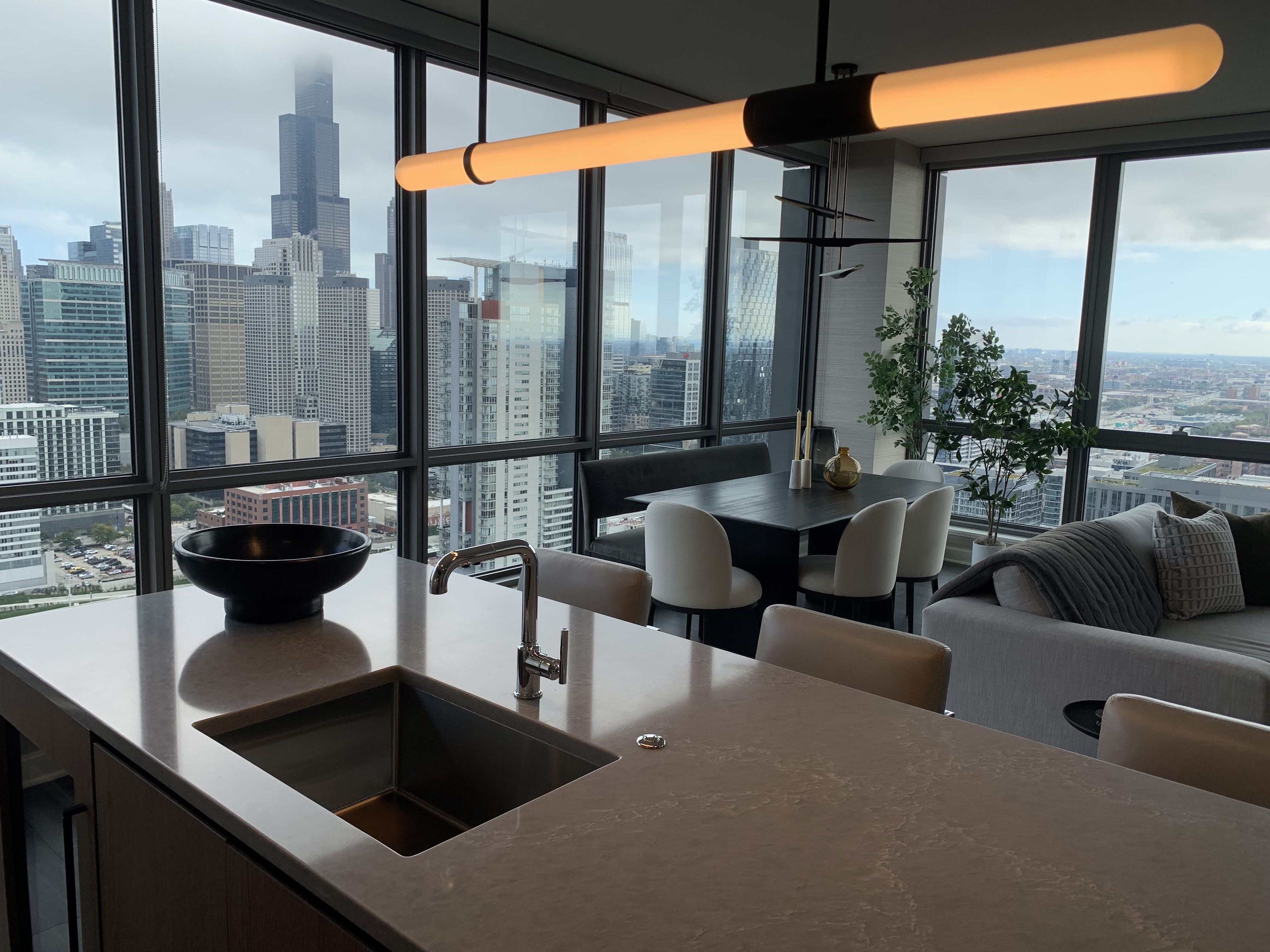 Photo of a kitchen and a view of a city skyline 