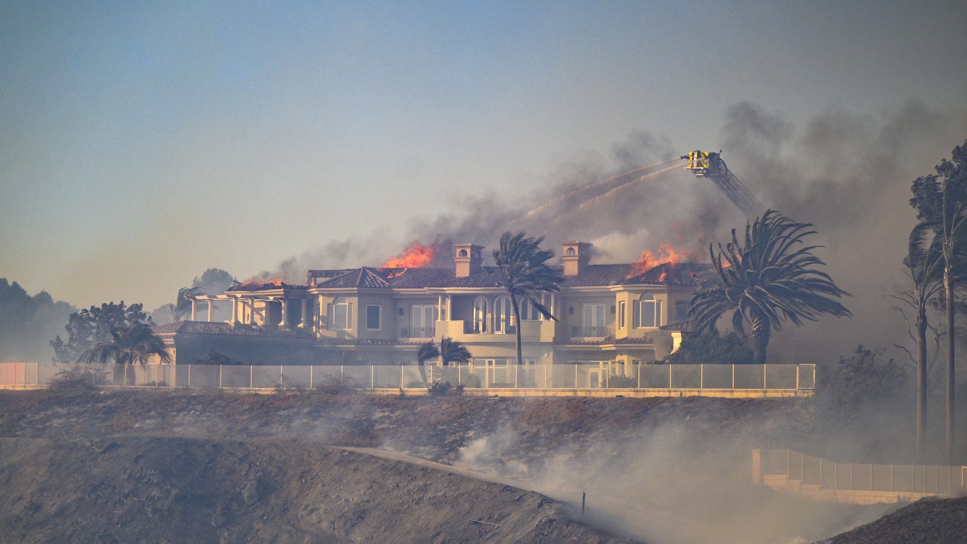 Firefighters battle the Coastal Fire in Laguna Niguel, CA, on Wednesday, May 11.