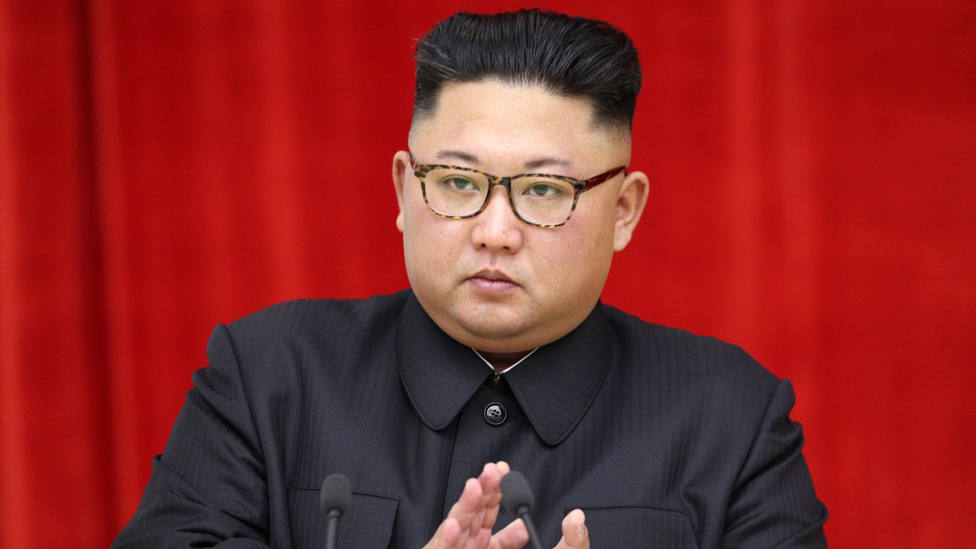 Kim Jong-un looks mad and claps.