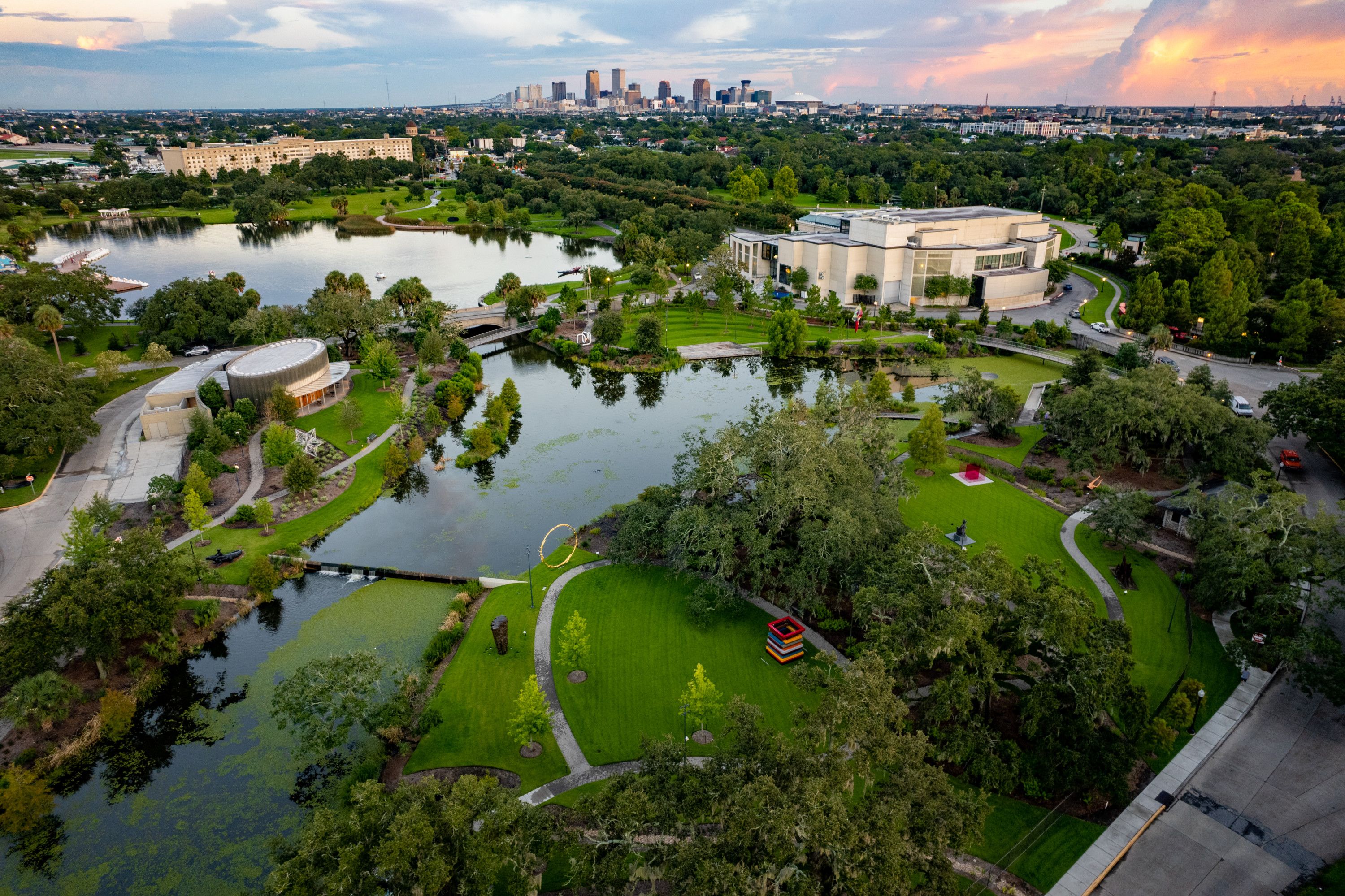 Photo shows the expanded sculpture garden with the New Orleans skyline in the background
