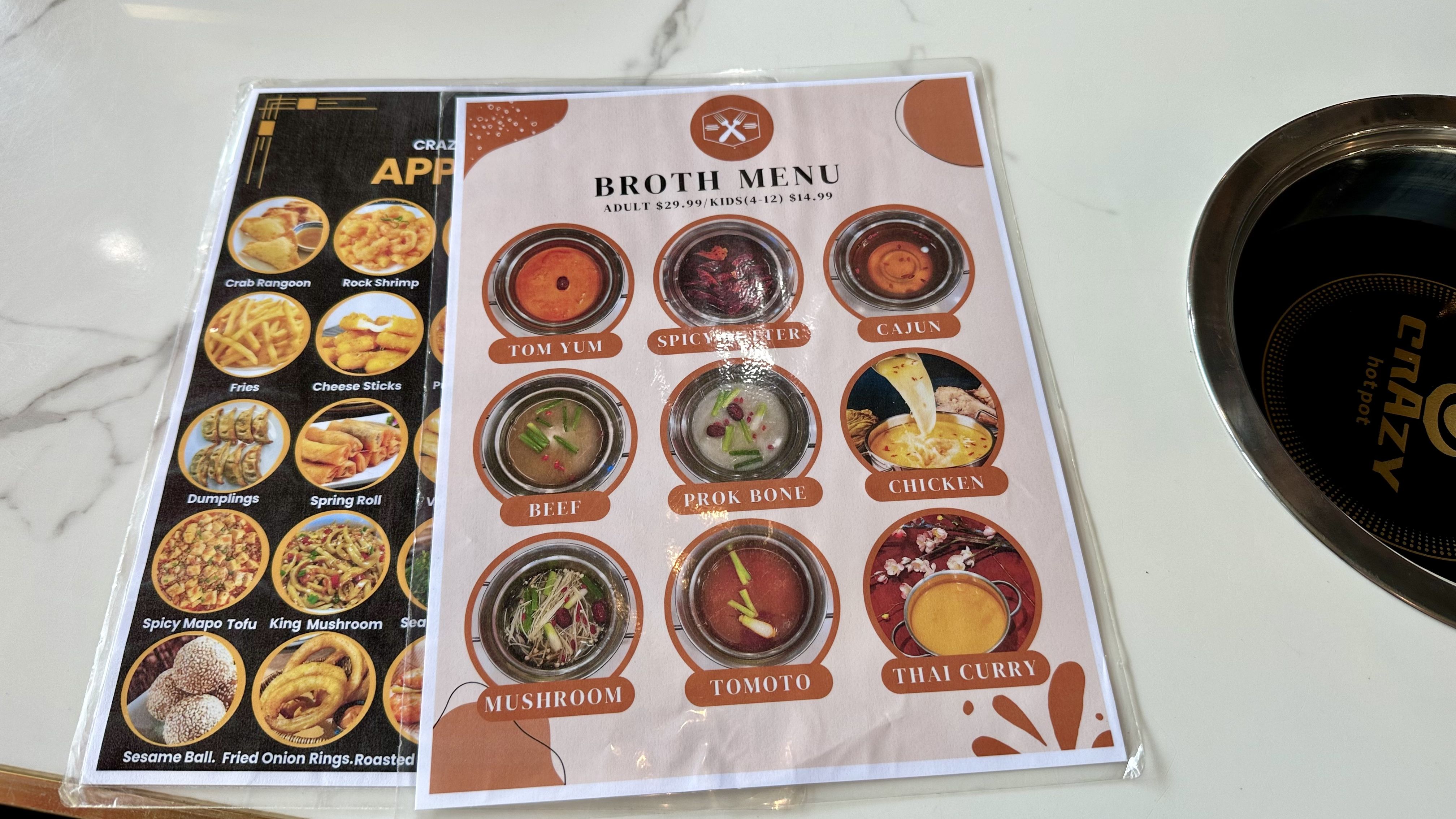 Photo shows a menu with the different broths at Crazy Hot Pot.