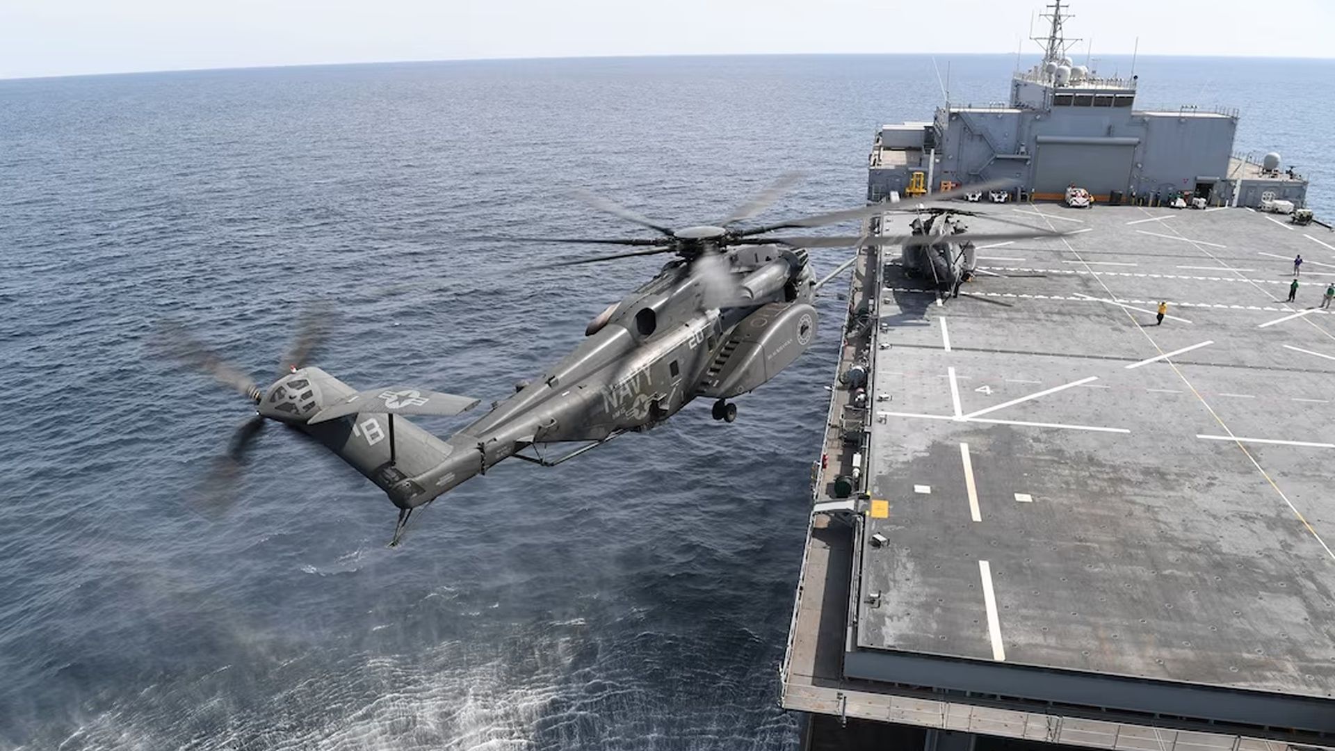 An MH-53E Sea Dragon, from Helicopter Mine Countermeasures Squadron (HM) 15, prepare to land on expeditionary mobile base platform ship USS Lewis B. Puller.