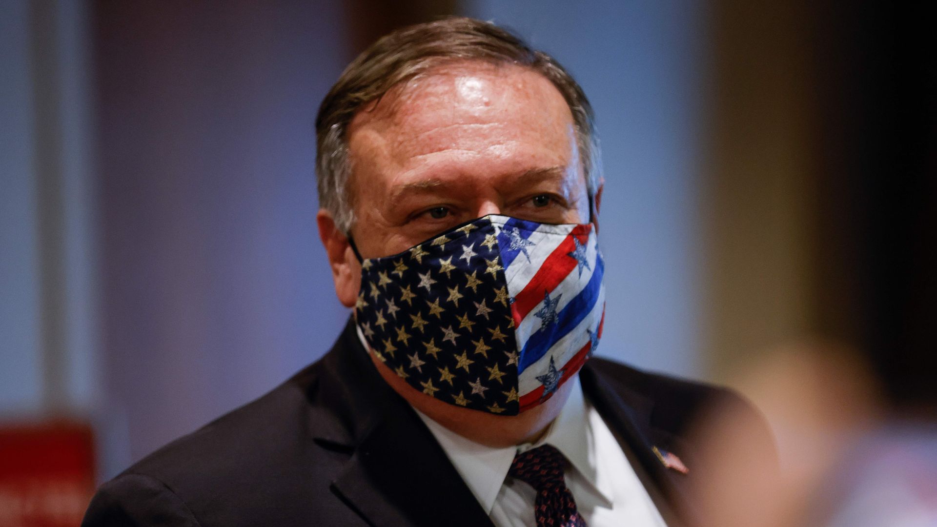 Secretary of State Mike Pompeo departs a meeting with members of the UN Security Council wearing mask