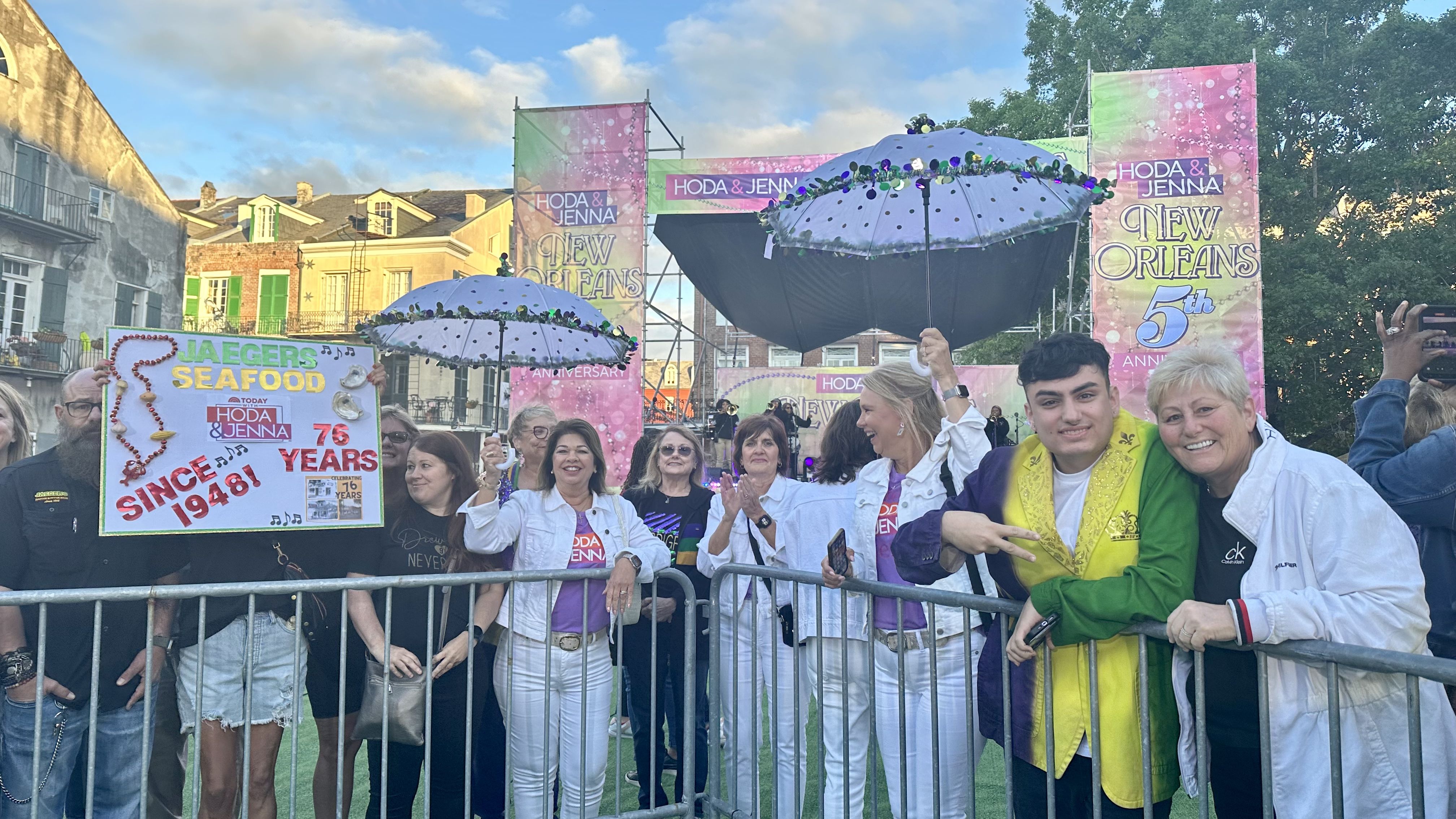 Photo shows people with second-line umbrellas waiting for Hoda and Jenna