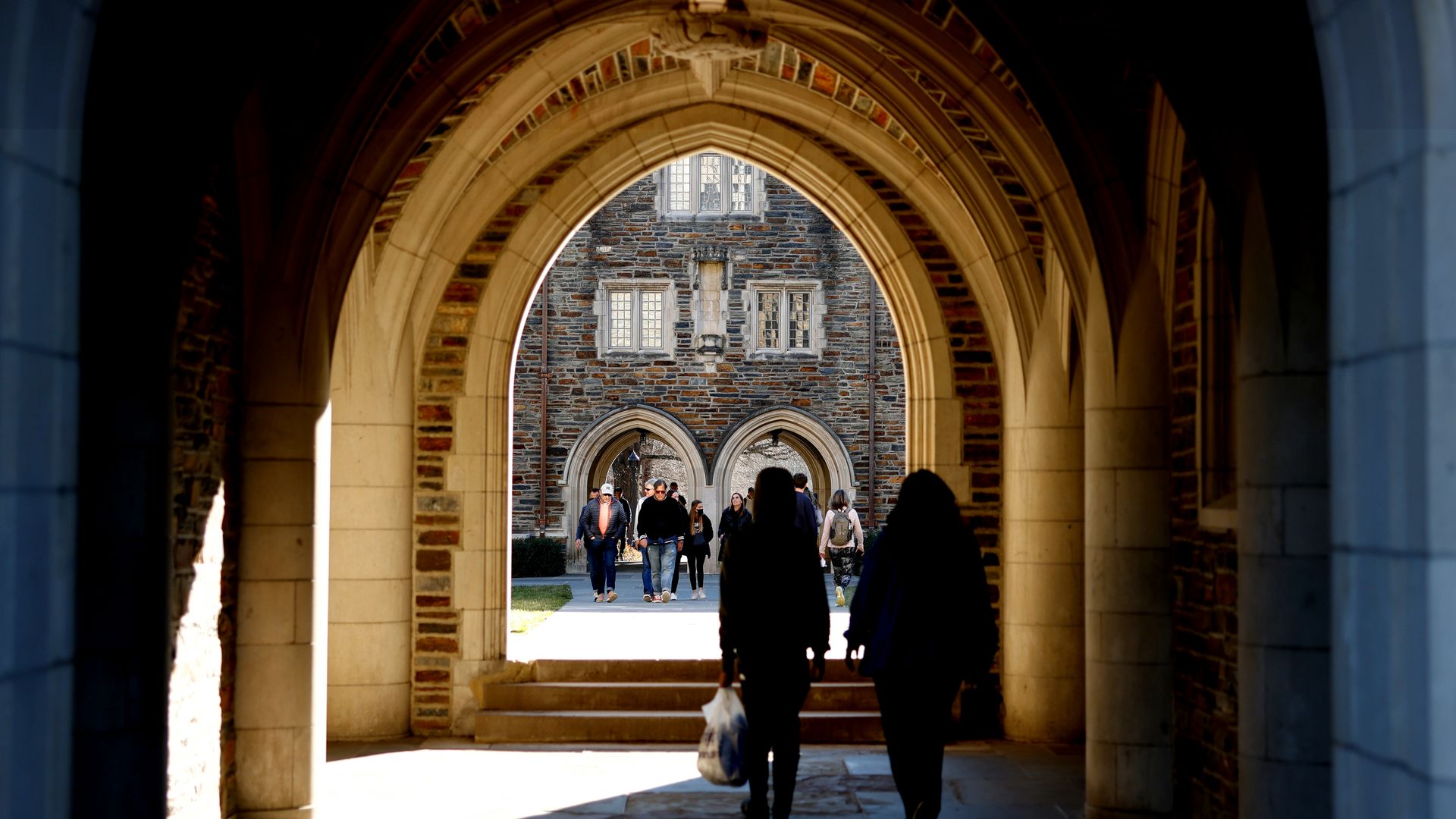 DURHAM, NC - FEBRUARY 19: People walk through the campus of Duke University ahead of the game between the Florida State Seminoles and the Duke Blue Devils on February 19, 2022 in Durham, North Carolina. (Photo by Lance King/Getty Images)