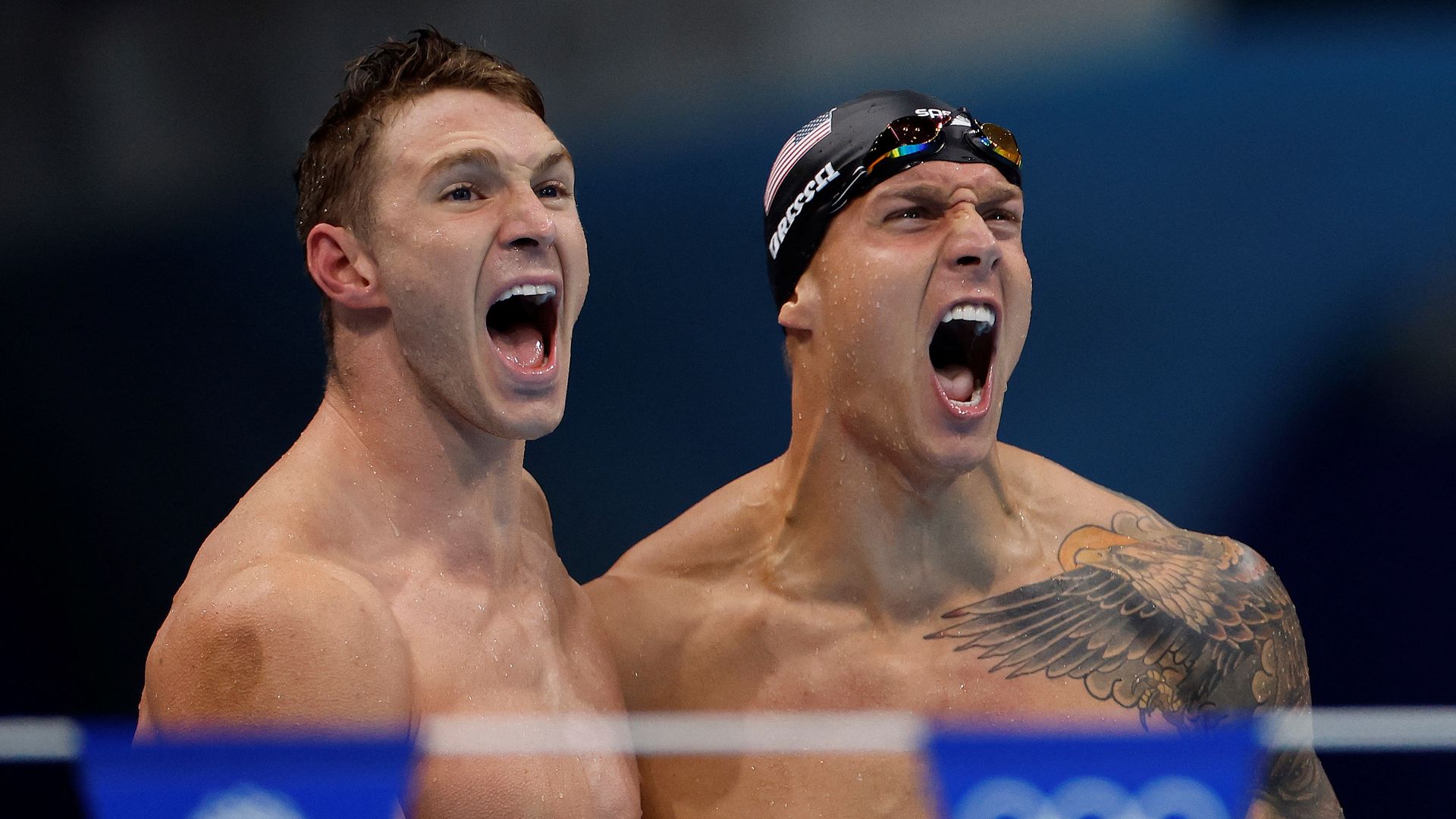 USA's Ryan Murphy (L) andCaeleb Dressel celebrate winning the final of the men's 4x100m medley relay swimming event during the Tokyo 2020 Olympic Games