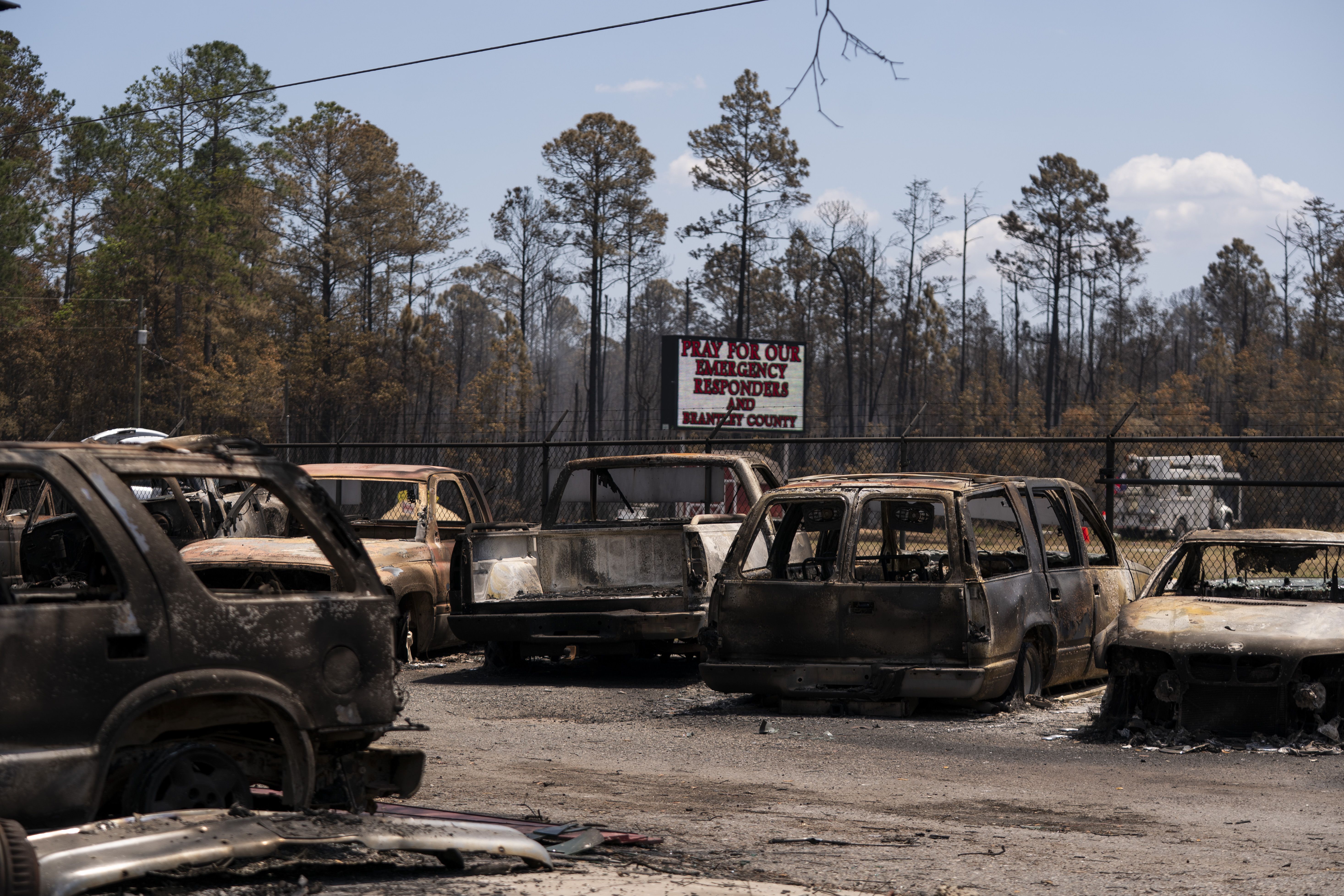An auto lot scarred by wildfires in Atkinson, Georgia, yesterday. Photo: Sean Rayford/Getty Images