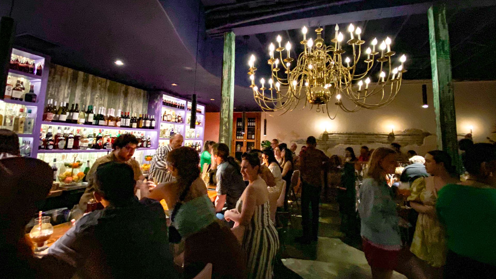 Interior of La Ruina, accentuated with an antique chandelier in the center of the room. 
