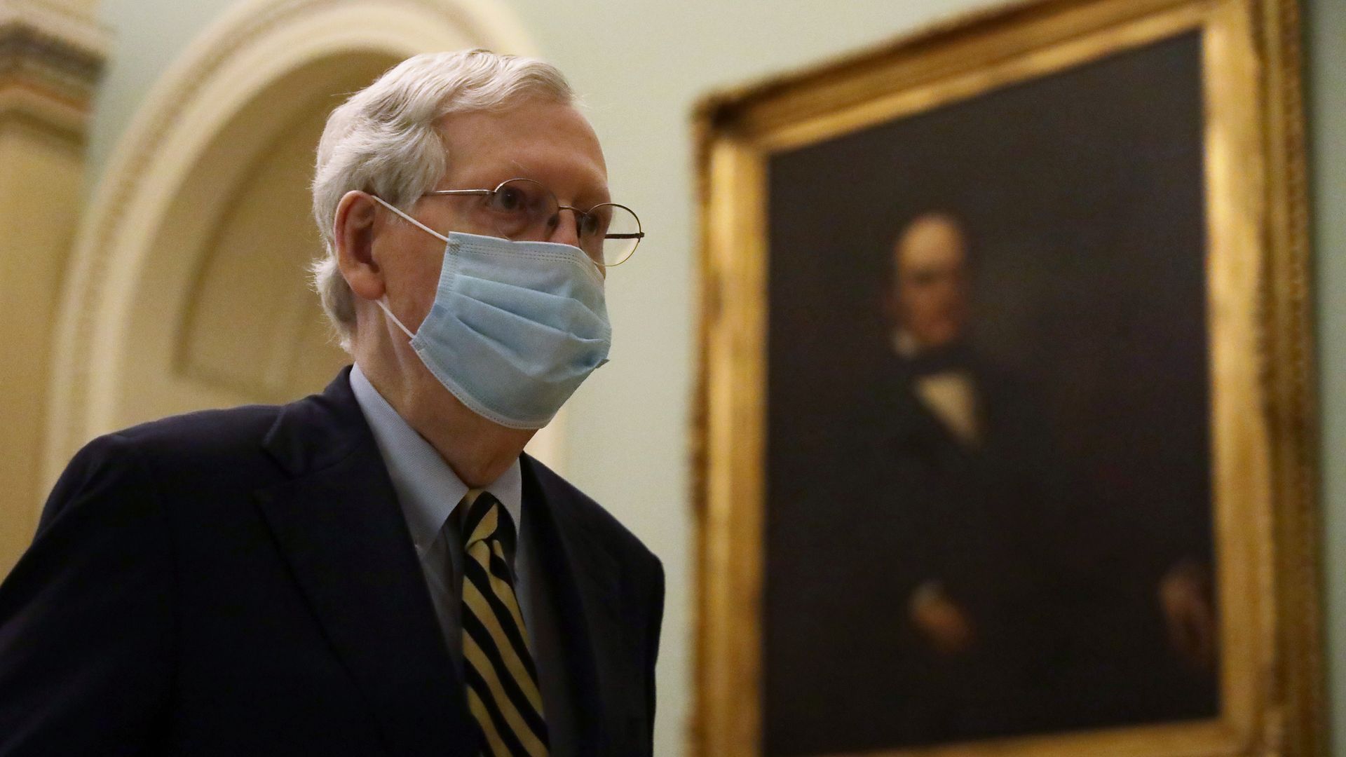 Senate Majority Leader Sen. Mitch McConnell (R-KY) wears a mask as he walks through a hallway at the U.S. Capitol May 11, 2020 in Washington, DC. 