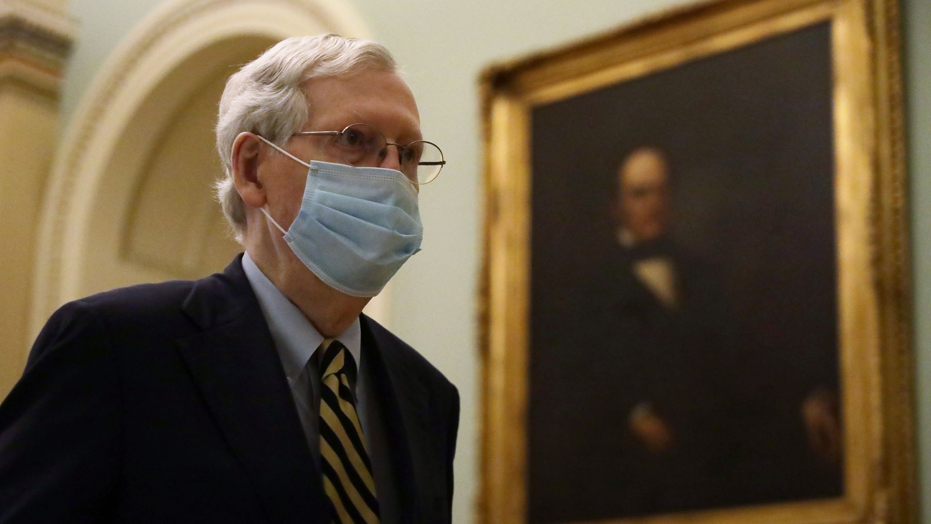Senate Majority Leader Sen. Mitch McConnell (R-KY) wears a mask as he walks through a hallway at the U.S. Capitol May 11, 2020 in Washington, DC.