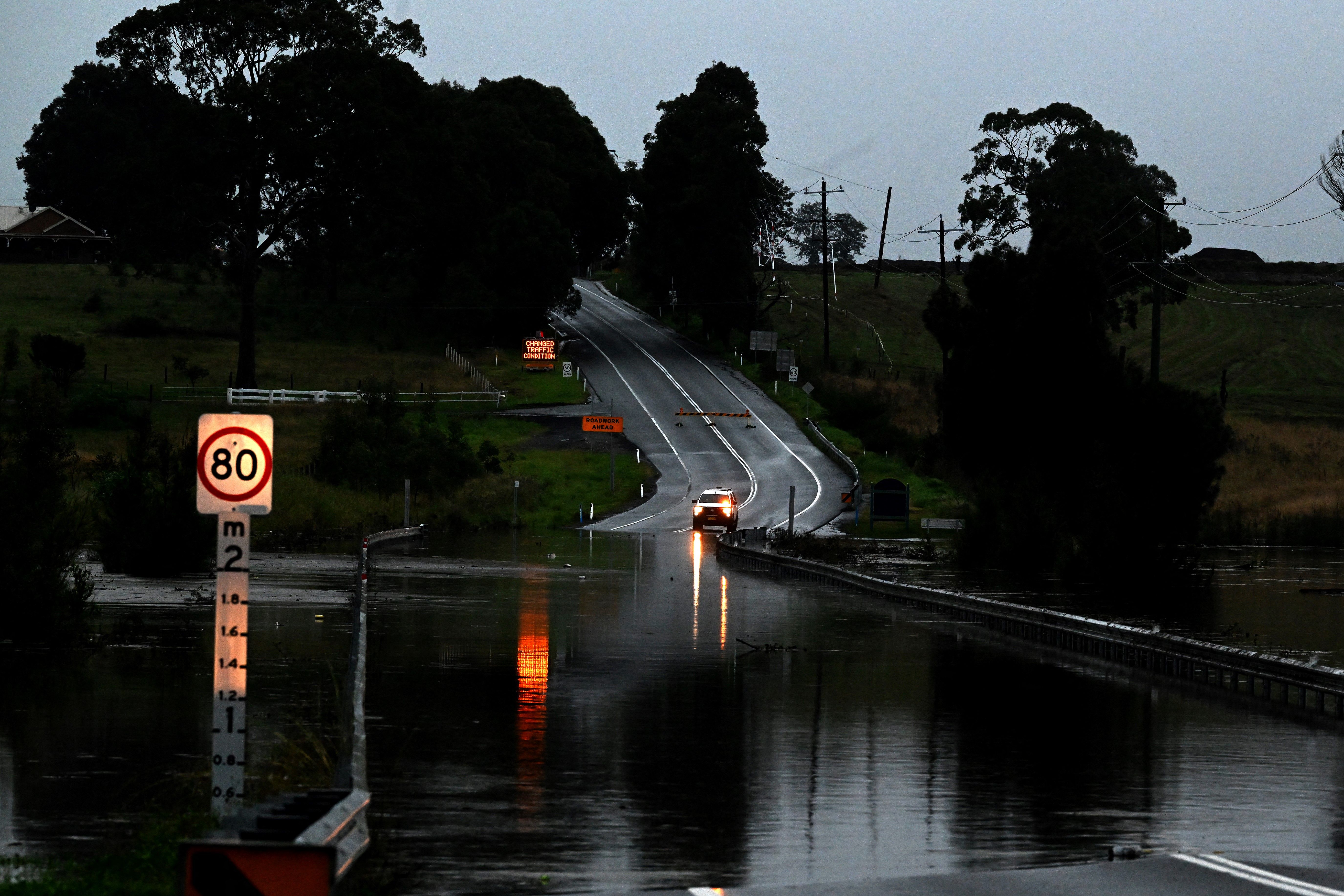 A road is seen flooded from the over flowing Wallis Creek in Gillieston Heights near New South Wales town of Maitland on May 22.