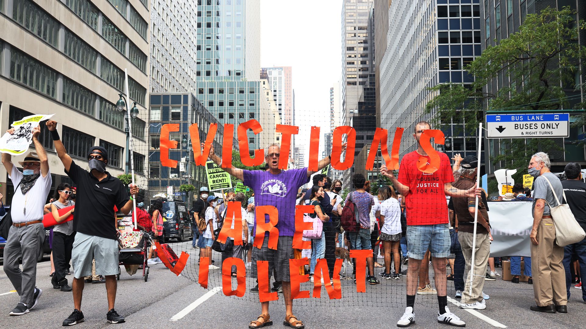 Someone holding an "evictions are violent" sign in New York.