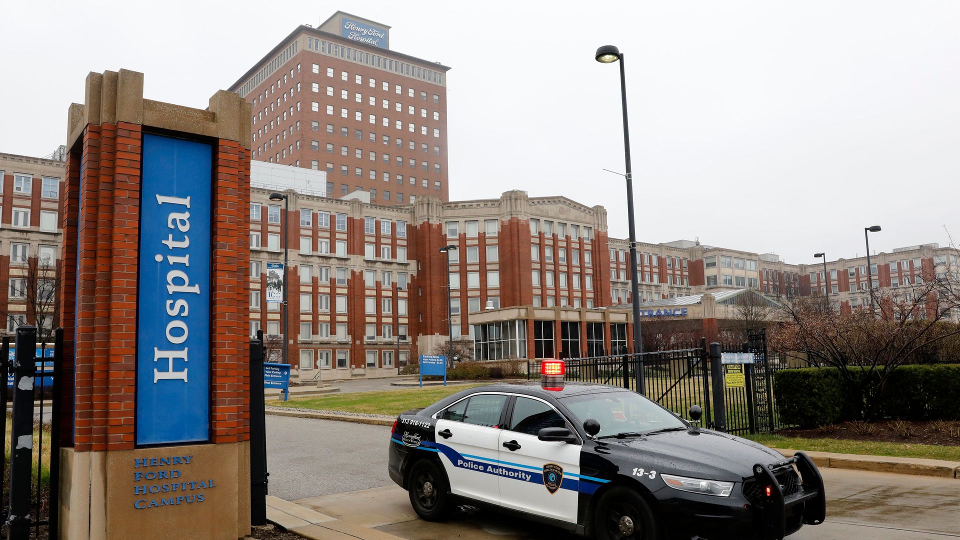 A police car leaves Henry Ford Hospital in Detroit, Michigan on April 7, 2020.