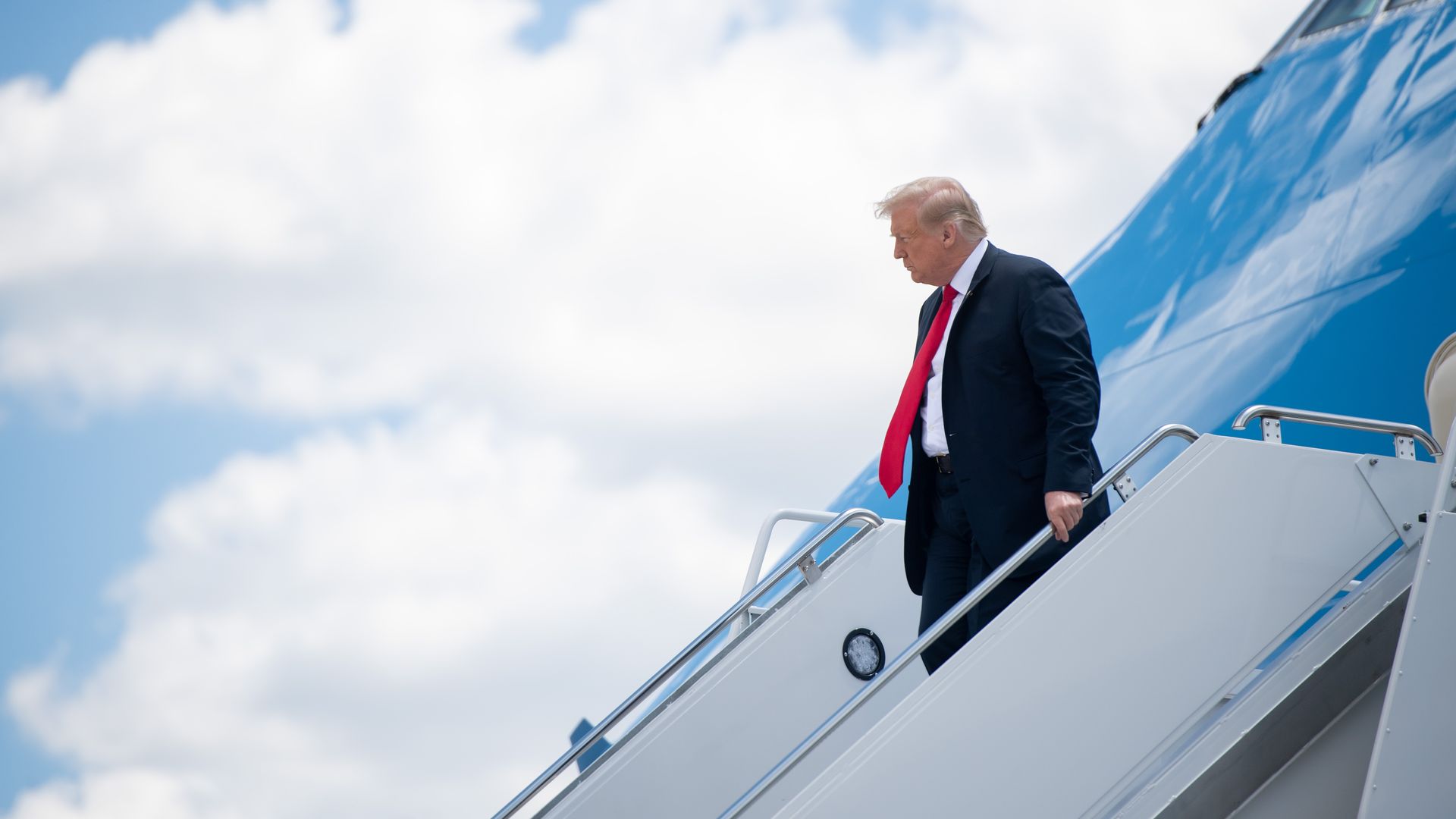 President Trump exits down a set of stairs