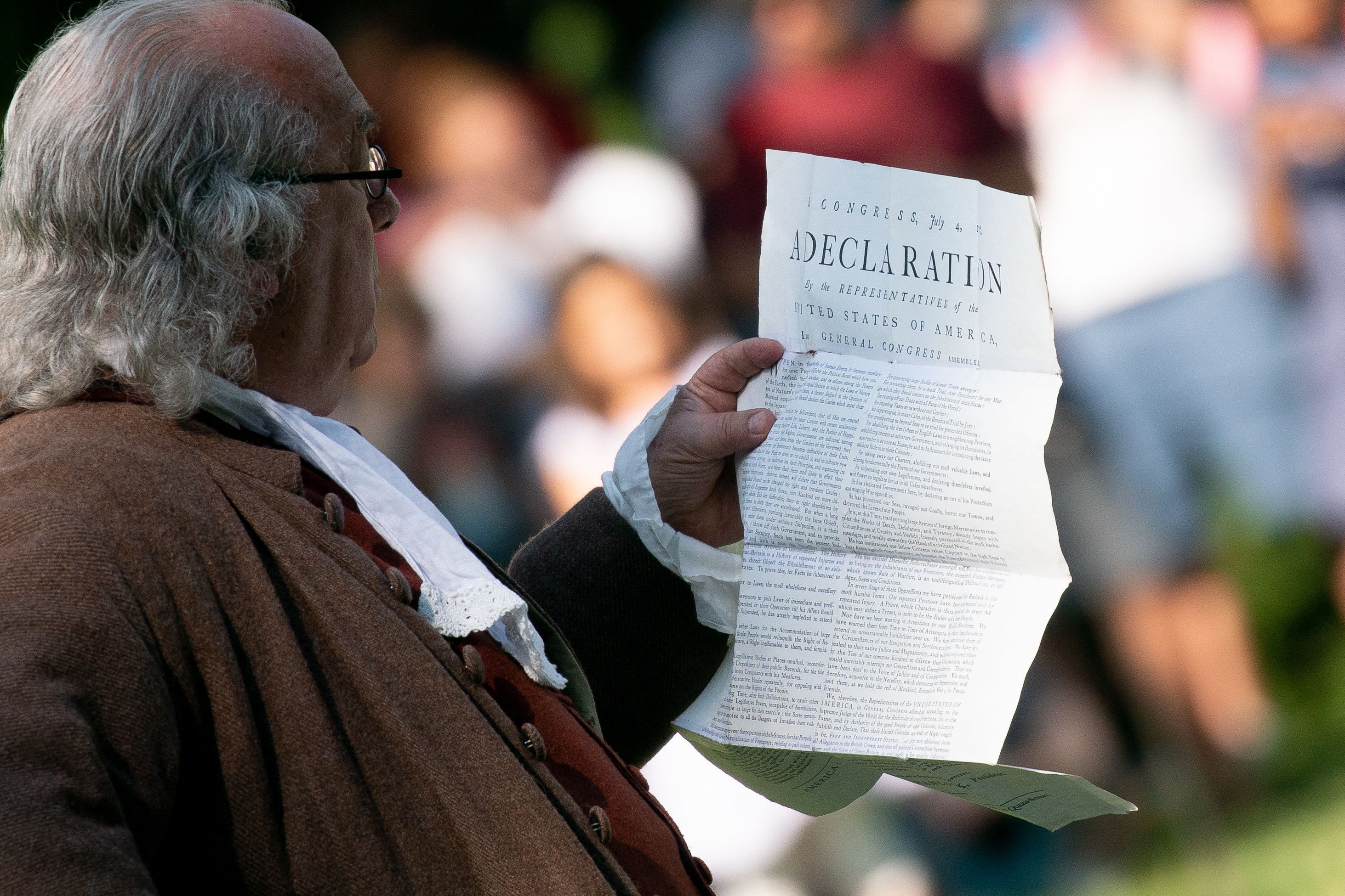 An actor impersonating Benjamin Franklin reads the Declaration of Independence on Independence Day at George Washington's Mount Vernon in Mount Vernon, Virginia, on July 4, 2023.