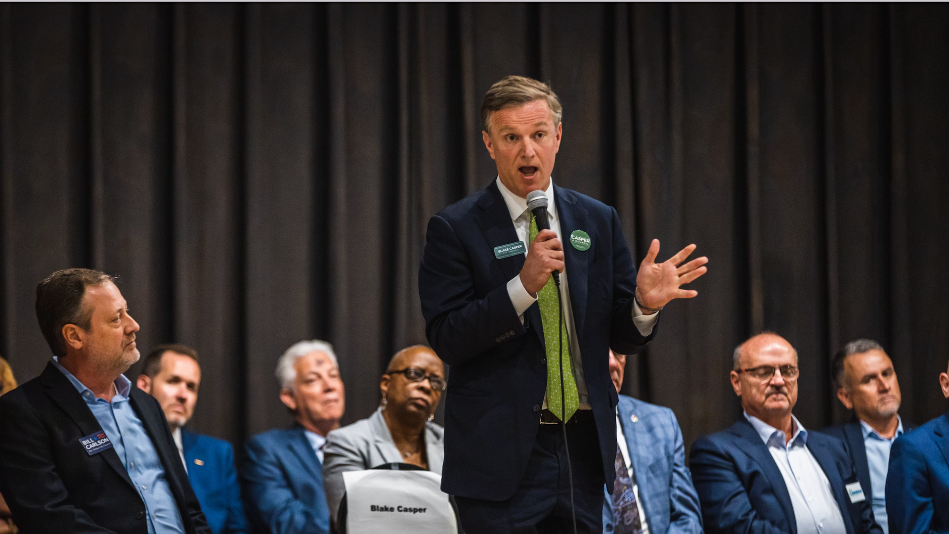 Candidates on stage for a forum.