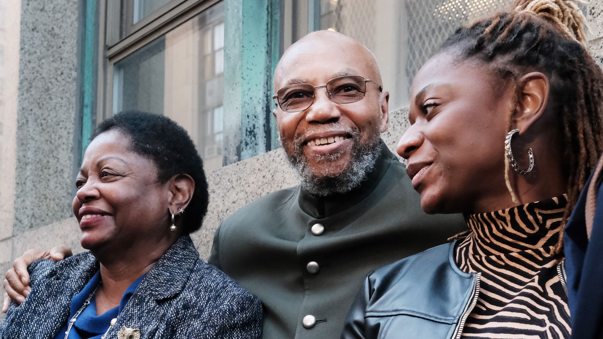 Muhammad Aziz stands outside of a New York City courthouse with members of his family and lawyers after his conviction in the killing of Malcolm X was thrown out on November 18, 2021.