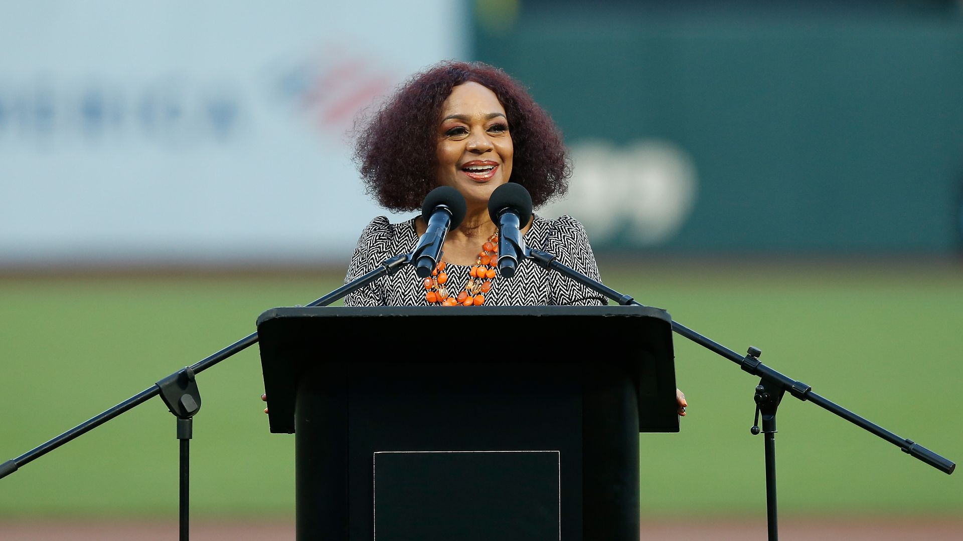 Photo of Renel Brooks-Moon speaking from a podium at Oracle Park