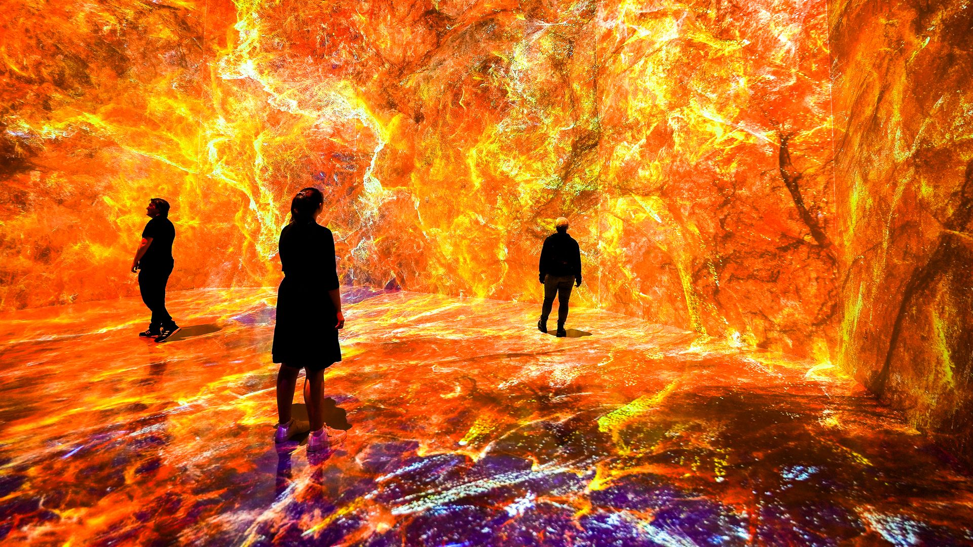 People stand in a space exhibit