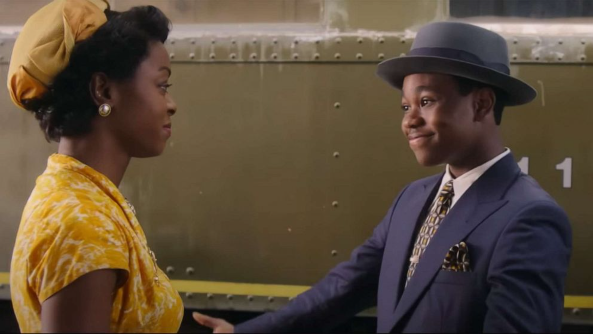 A still from the movie Till, where a woman and young boy stand looking at each other.