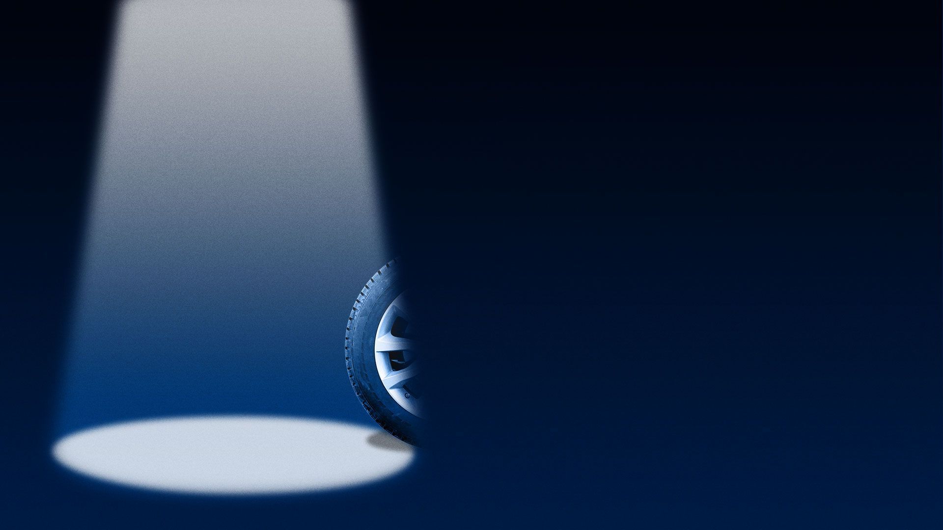 Illustration of a tire almost out of the spotlight